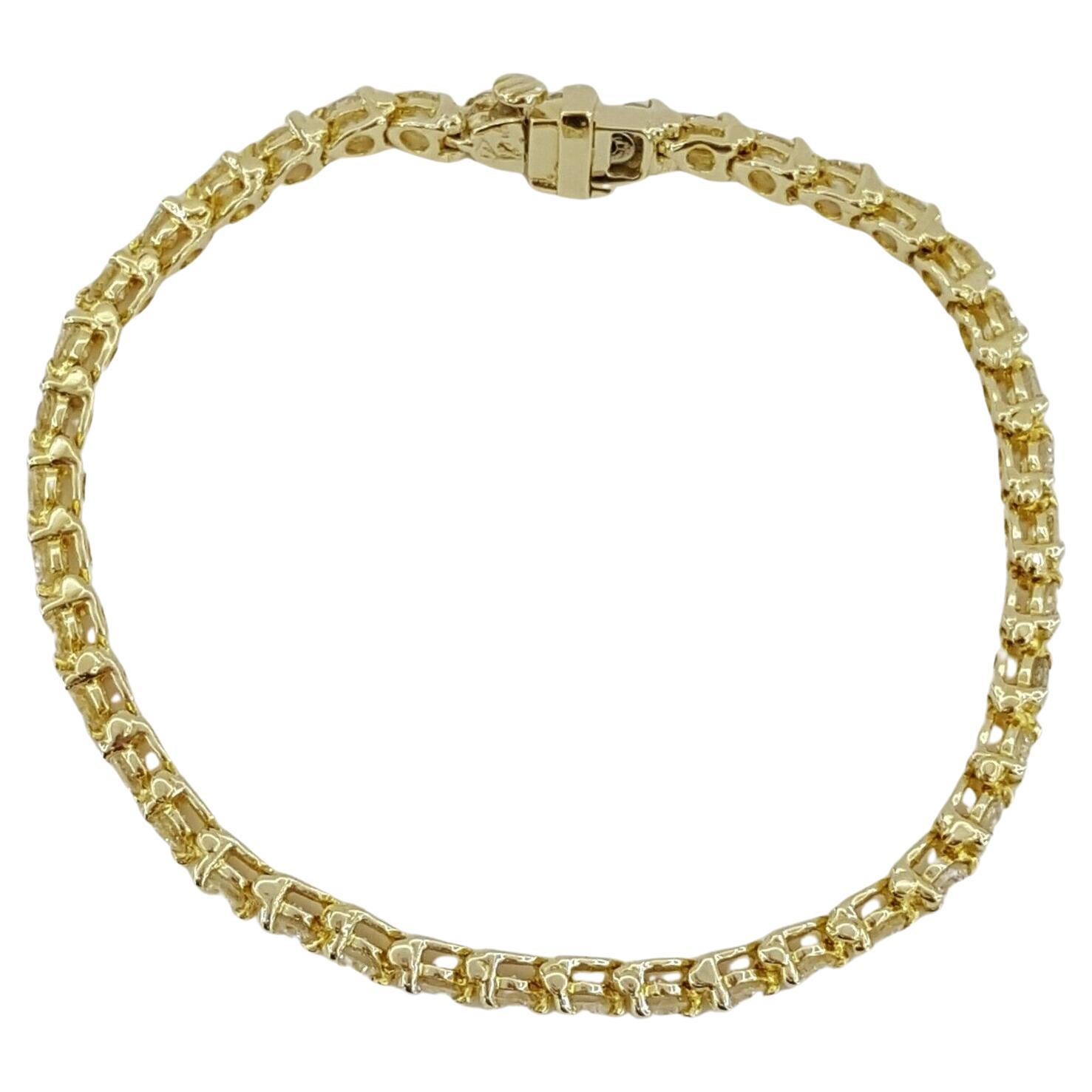 Presenting a radiant tennis bracelet that beautifully combines classic elegance with a dazzling display of light. Crafted in 14K yellow gold, this bracelet is a luxurious accessory for any occasion.

Key Details:
- The bracelet is set with 41