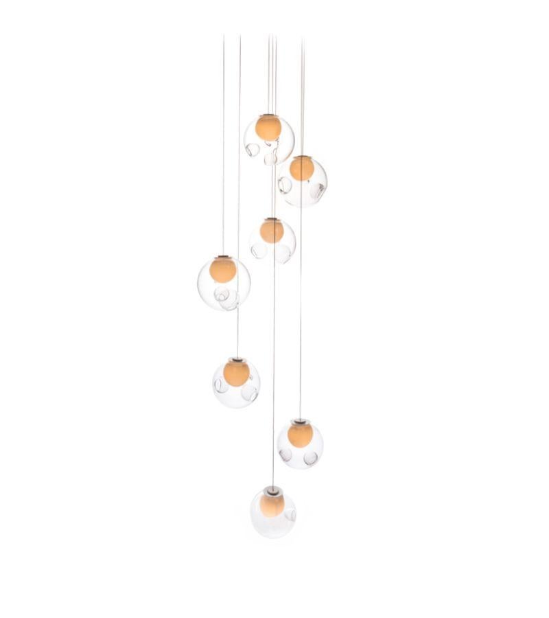 28.7 Pendant lamp by Bocci
Dimensions: Diameter 30.5 x Height 300 cm 
Materials: blown glass, braided metal coaxial cable, electrical components, brushed nickel canopy.
Lamping: : 1.5w LED or 20w xenon. Non-dimmable. 
Coax: adjustable. 3000mm