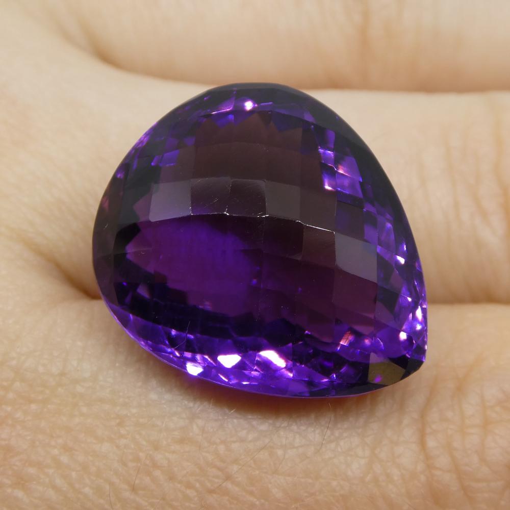 Description:

Gem Type: Amethyst
Number of Stones: 1
Weight: 28.75 cts
Measurements: 21.90x18.50x12.50 mm
Shape: Pear
Cutting Style Crown: Modified Brilliant
Cutting Style Pavilion: Modified Brilliant
Transparency: Transparent
Clarity: Very Slightly