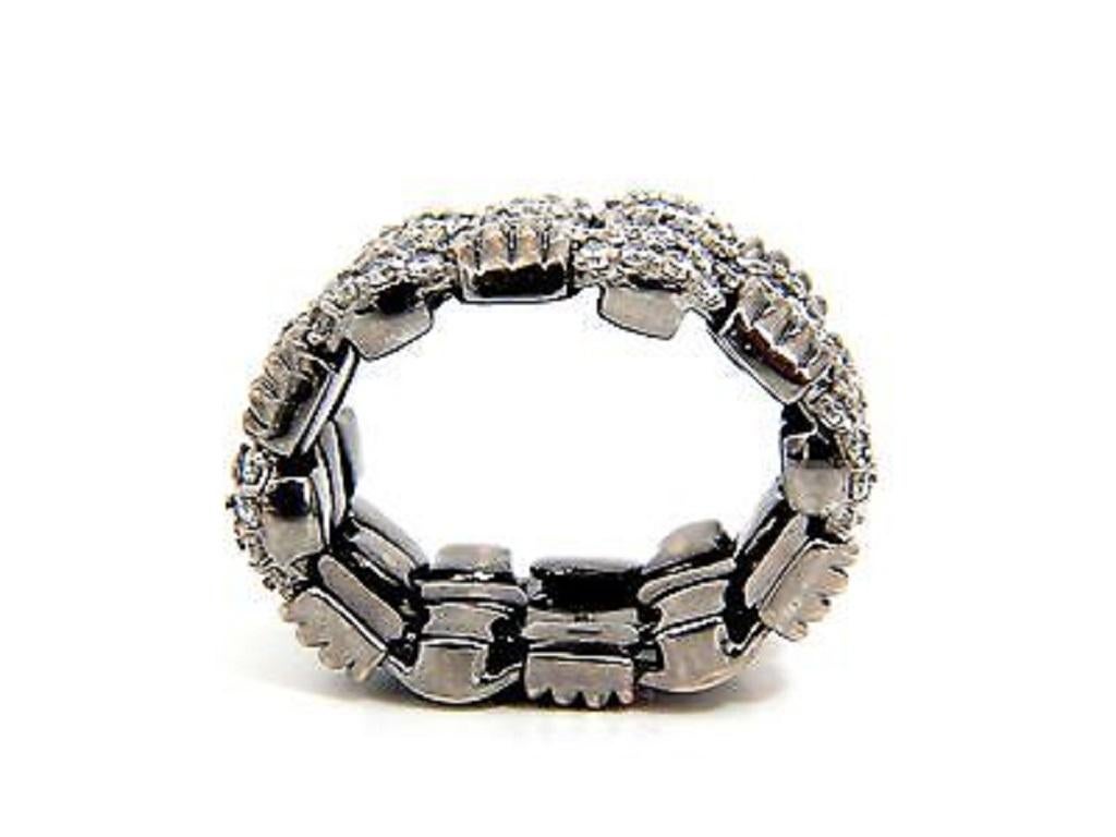 Hinged Flexible Ribbed Grill Crosshatch 3D Deco Ring

Diamonds mounted bead set pave 

2.87ct. 

Rounds & Full cuts

F/G-color 

Vs-2 clarity.

18Kt Blackened Gold

20.5 Grams

Overall ring: 

.63 Inch wide 

.15 Inch Depth

Can be worn from sizes