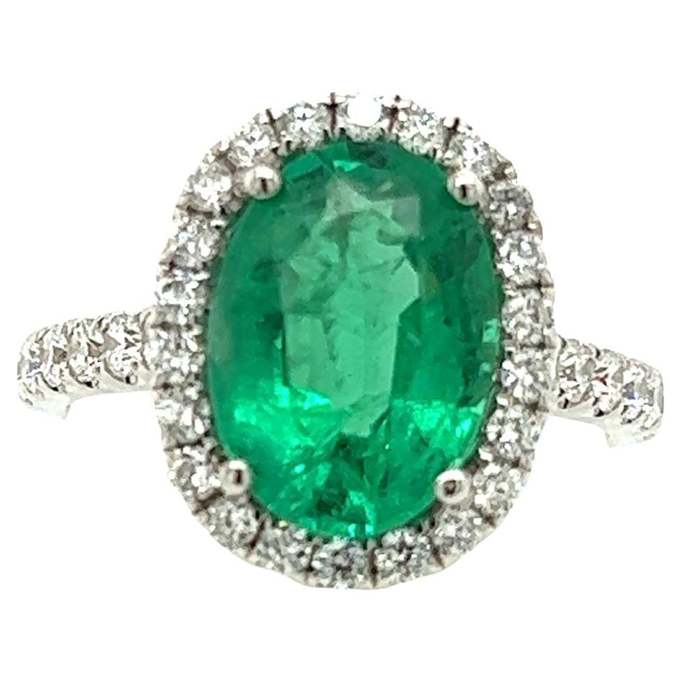 2.88 Carat Emerald & Diamond Halo Ring in 18 Karat White Gold For Sale