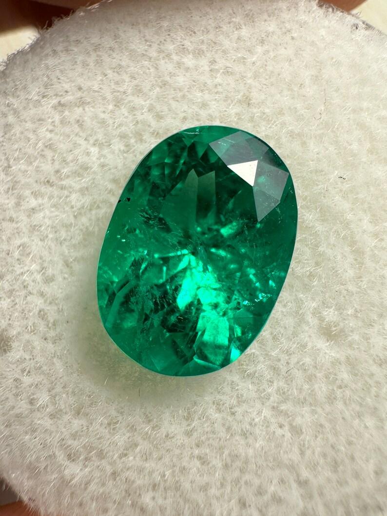 Stone: Emerald
Weight: 2.88-carats
Shape: Oval Cut
Clarity: Transparent
Luster: Excellent
Color: Vivid Green
Measurements: 10.93mm x 7.86mm x 6.60mm
Geographic Origin: Colombia
Treatment: Natural, Oiling

Comments: Due to their growth conditions in