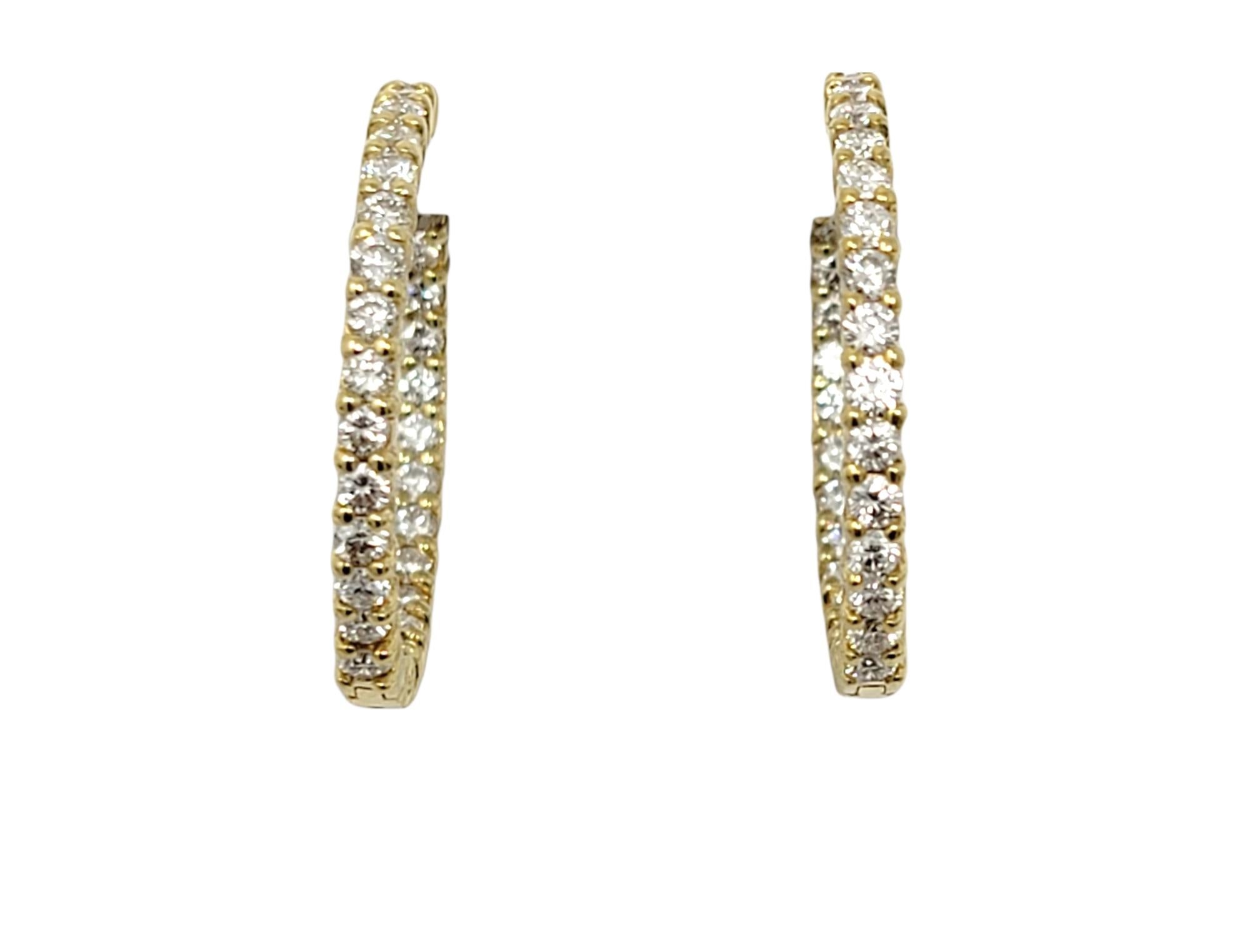 If you are looking for dazzling sparkle from every angle, these stunning diamond hoop earrings will not disappoint! Arranged in a unique inside/outside setting, the diamonds are positioned to catch the light from different angles, making your lobes