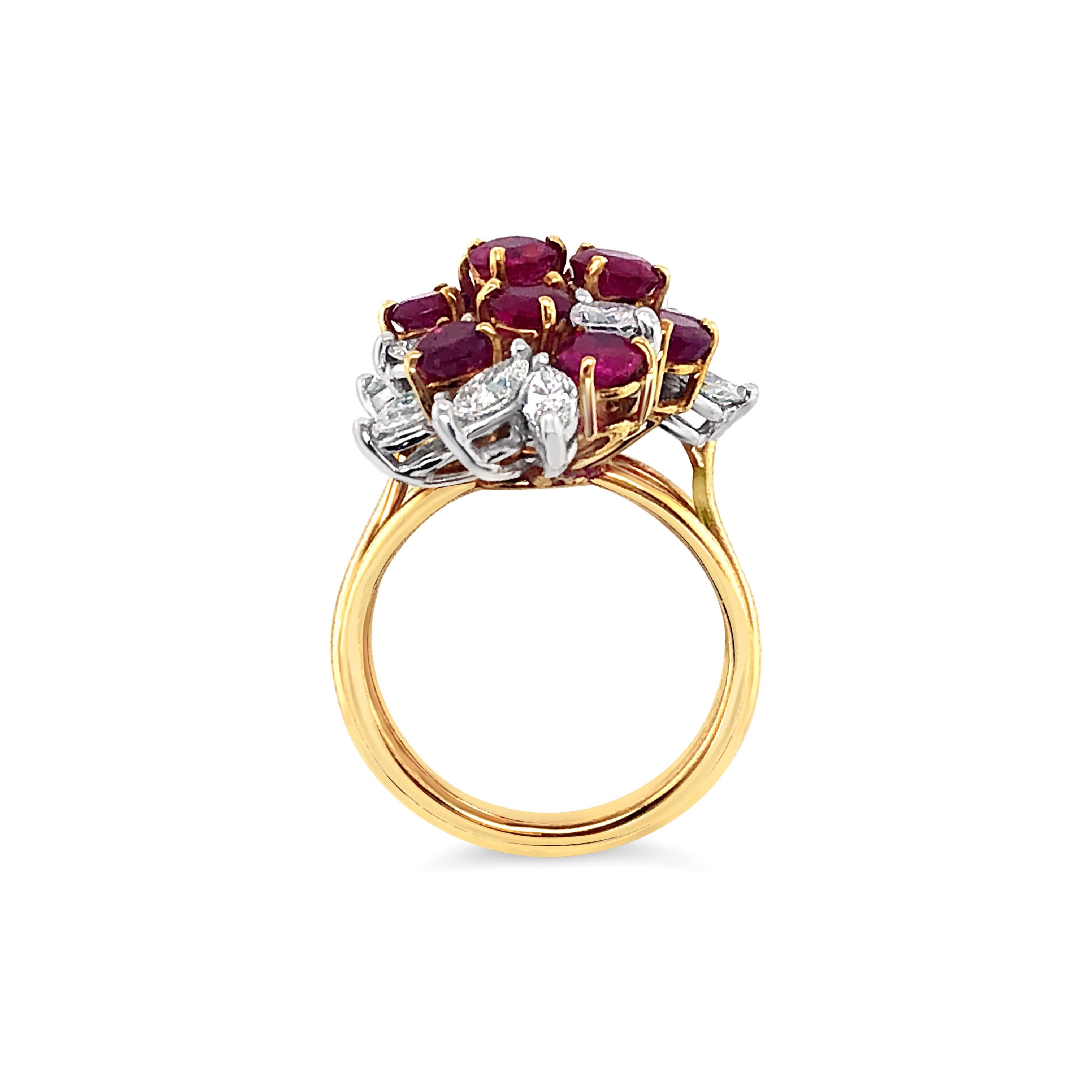 2.88 Carat (total weight) Round Cut Ruby and 1.37 Carat (total weight) Marquise Cut Diamond Cluster Ring set in 18K Yellow Gold.  Diamonds range in Color I-J, Clarity VS2-SI1 and are set in Platinum.