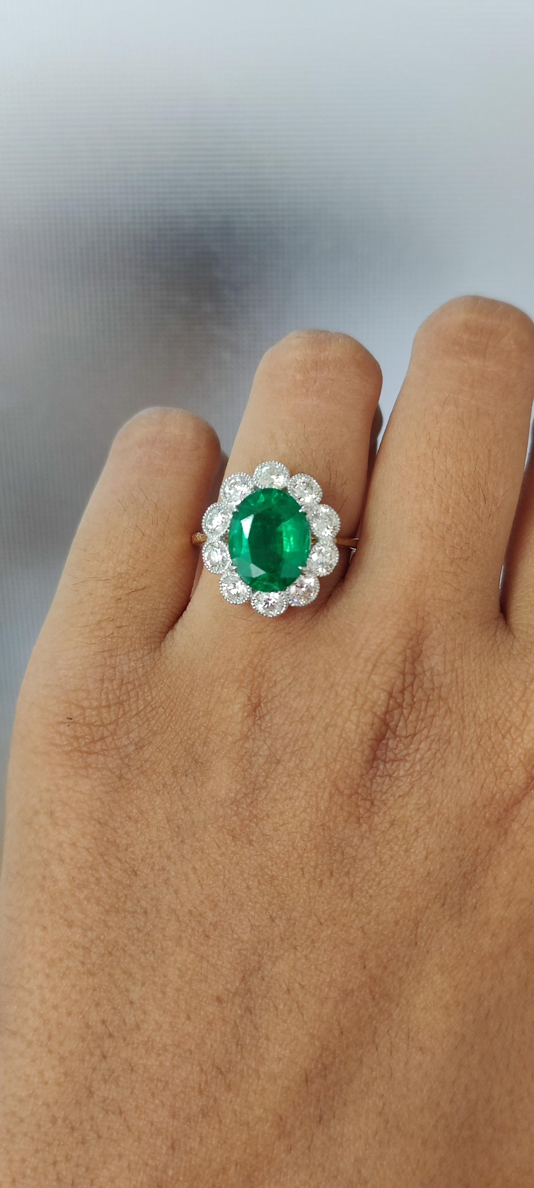 Presenting a masterpiece of a ring that perfectly combines the vivid green elegance of a meticulously cut Emerald with the brilliance of sparkling round Diamonds.

Originating from the enchanting mines of Ethiopia, the 2.88 Carat Emerald boasts a