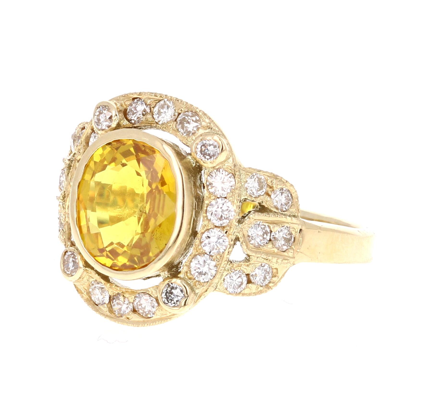Art Deco Inspired Yellow Sapphire and Diamond Ring! 
This ring has a 2.25 Oval Cut Yellow Sapphire in the center of the ring and is surrounded by a cluster of 30 Round Cut Diamonds that weigh 0.63 carats. The clarity and color is VS2/H.  The total