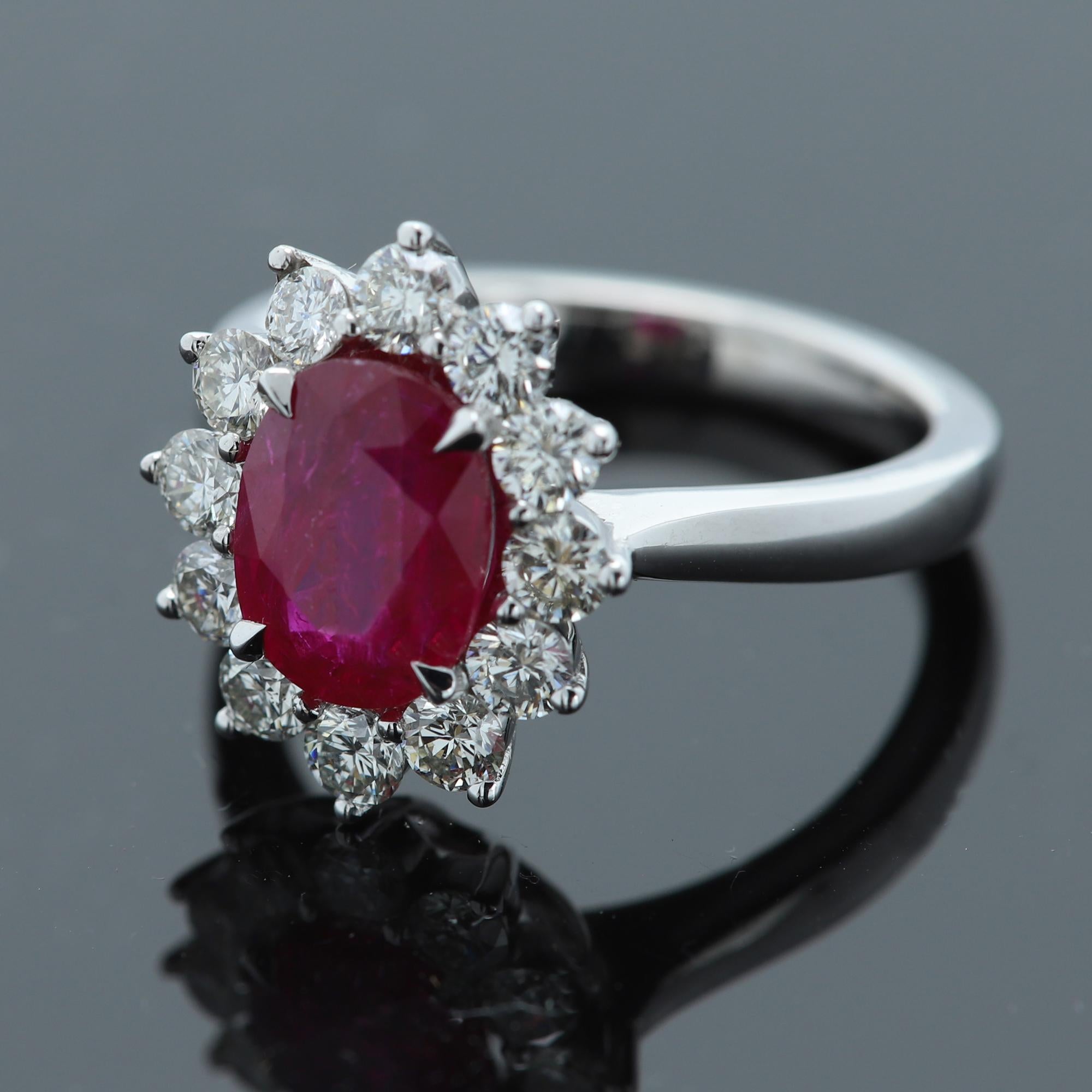 Classic Diana Style Ruby & Diamonds Cocktail Ring
18k White Gold 7.2 grams  
Ruby 2.88 Carat Oval shape approx size 9 x 7 mm Strong Red Red Tone with some inclusions that are not significant visable to the regular distance eye, the stone is