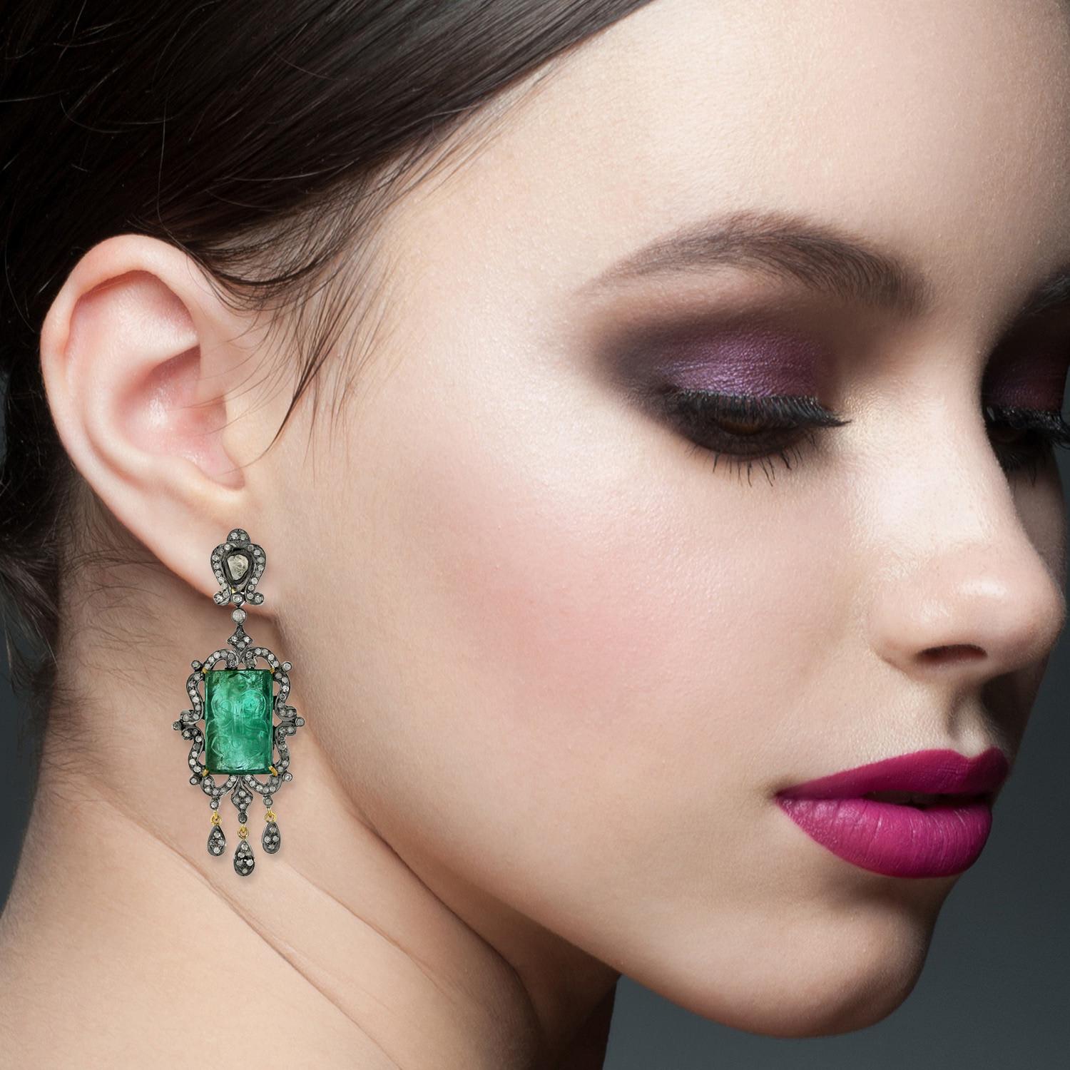 These hand carved earrings are meticulously crafted in 18-karat gold and sterling silver.  It is set in 28.9 carats Emerald and 2.61 carats of glimmering diamonds.

FOLLOW  MEGHNA JEWELS storefront to view the latest collection & exclusive pieces. 