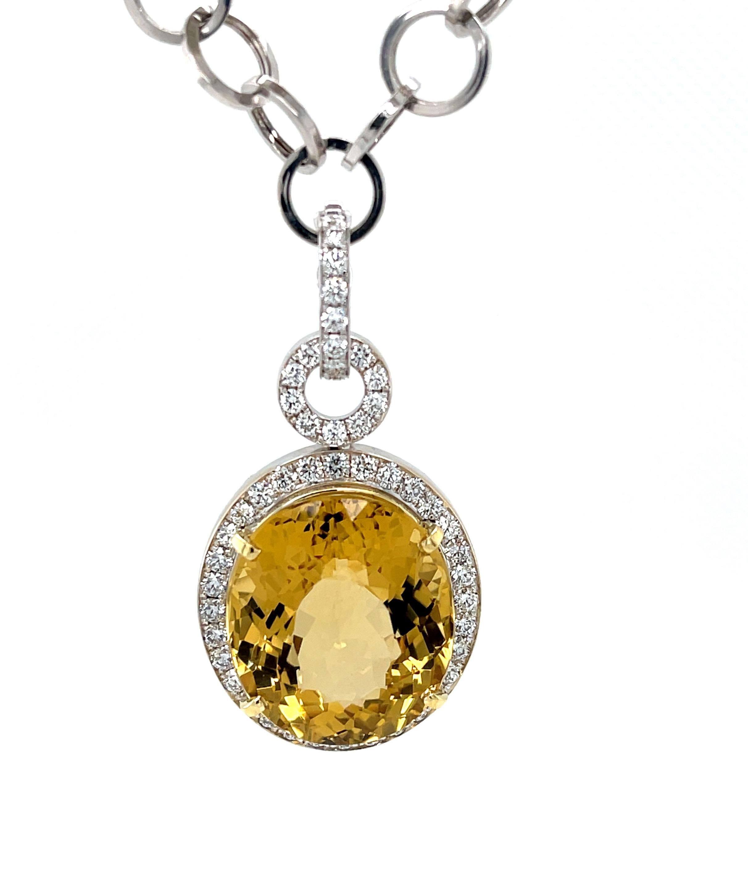 This gorgeous statement necklace features an exquisite 28.90 carat oval golden beryl with spectacular color! While the beryl mineral family includes calm blue aquamarine and gentle pink morganite, golden beryl is like crystalline sunshine - warm,