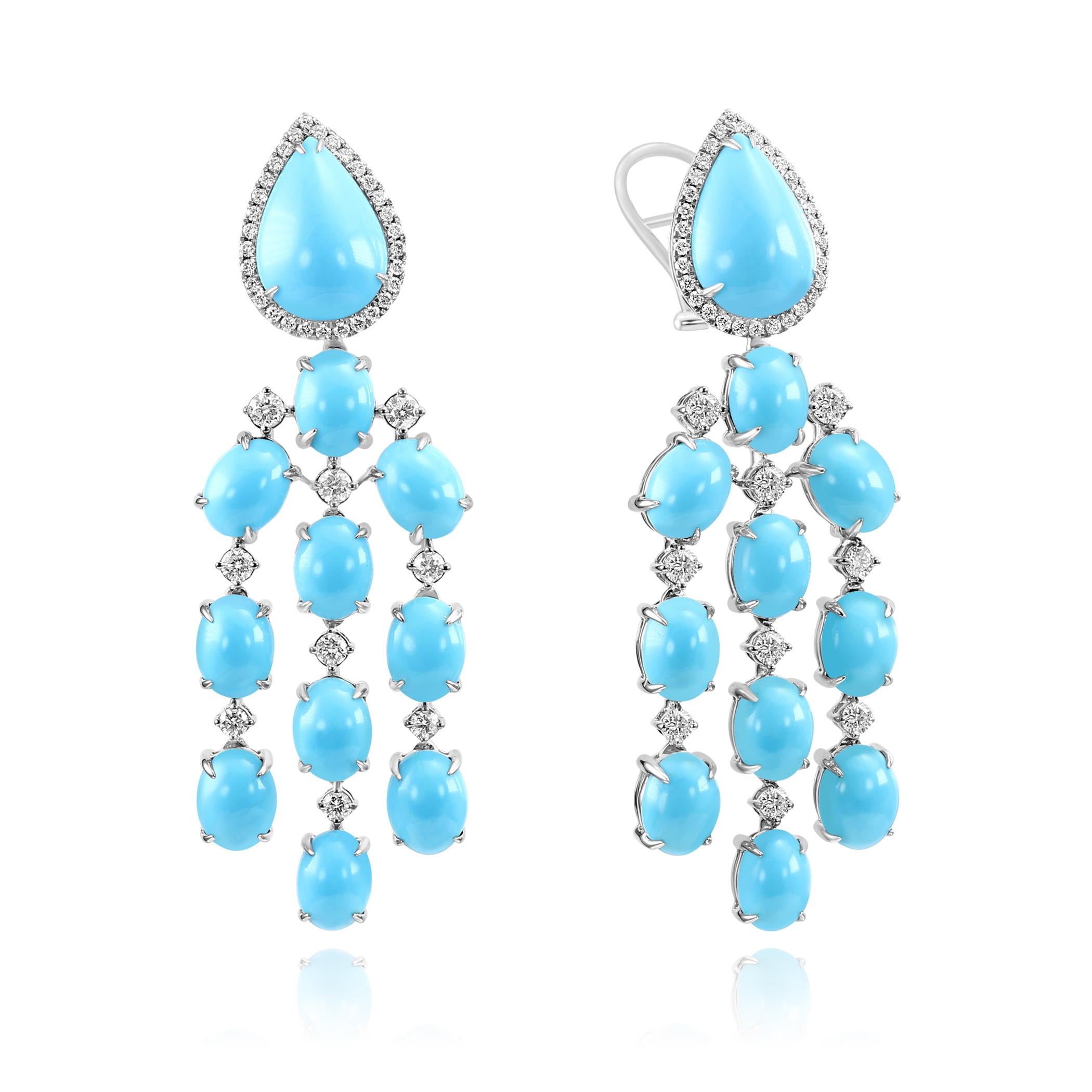 Fai una dichiarazione d'effetto con questi radiosi orecchini pendenti in oro bianco 14K, caratterizzati dalla vibrante bellezza del turchese naturale abbinata alla brillantezza dei diamanti. Progettata con cura per coloro che apprezzano un'eleganza