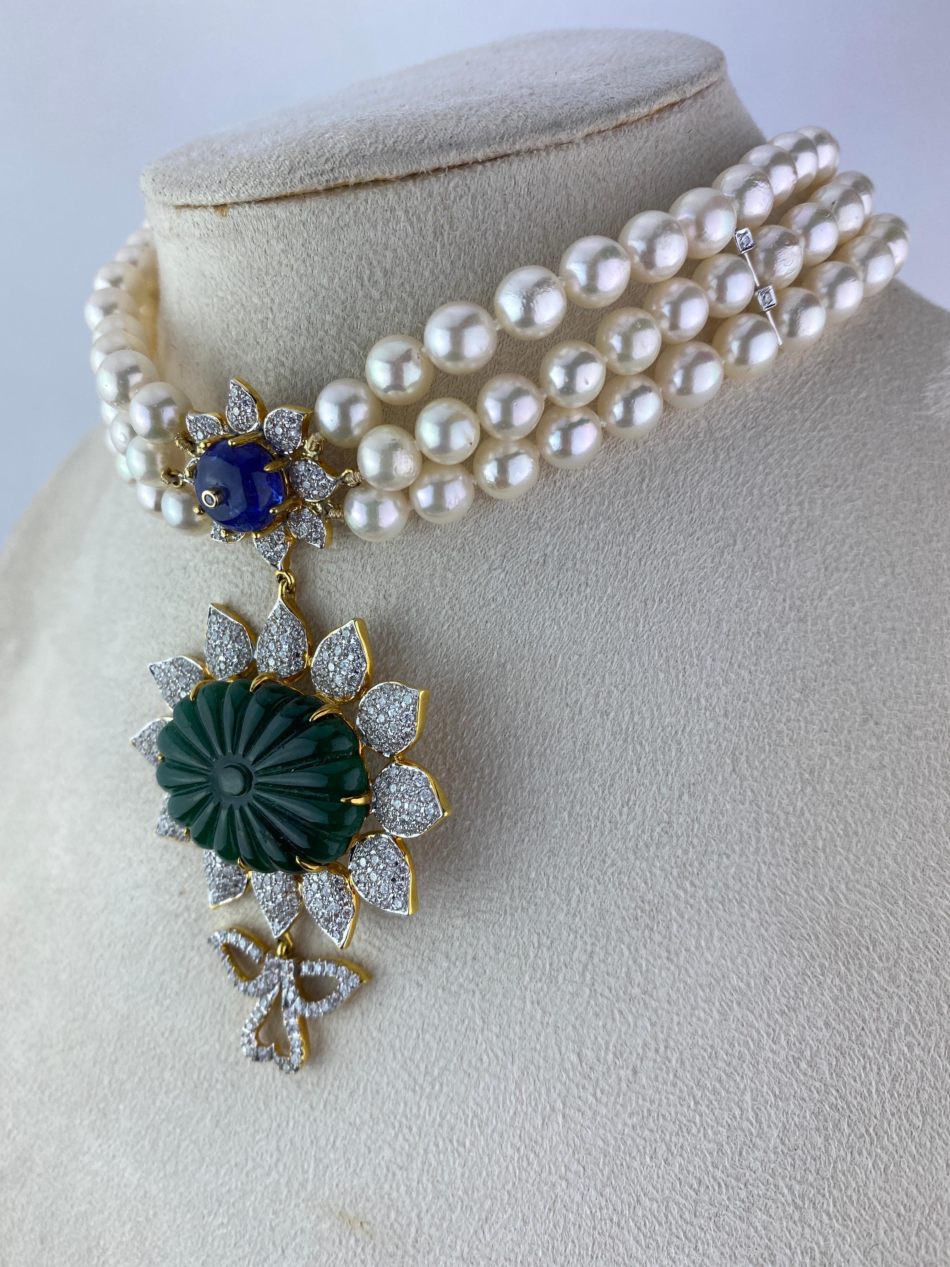 A beautiful, art-deco inspired choker - with 28.95 carat carved Emerald, 5.92 carat Tanzanite, 3.76 carat White Diamonds set in 9K Yellow Gold. The length of the choker is currently 12 inches in length, but it can be altered according to your