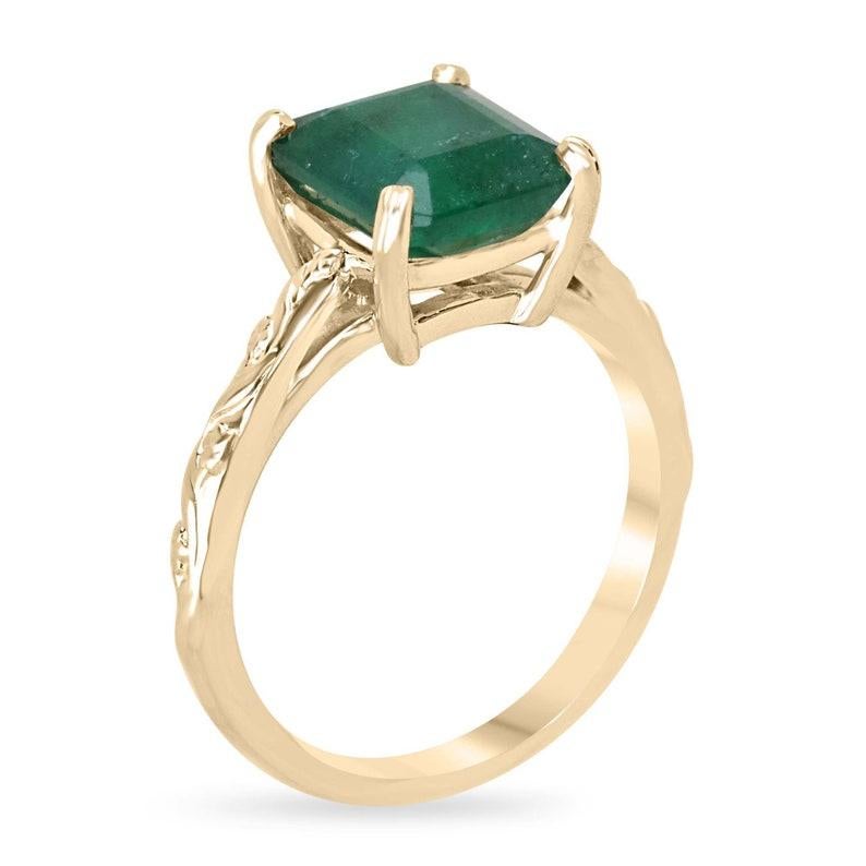 Elevate your elegance with our exquisite solitaire emerald ring, boasting a captivating 2.89-carat emerald cut emerald. Its mesmerizing semi-transparent clarity and deep green hue exude timeless allure, perfectly showcased in a 14k yellow gold