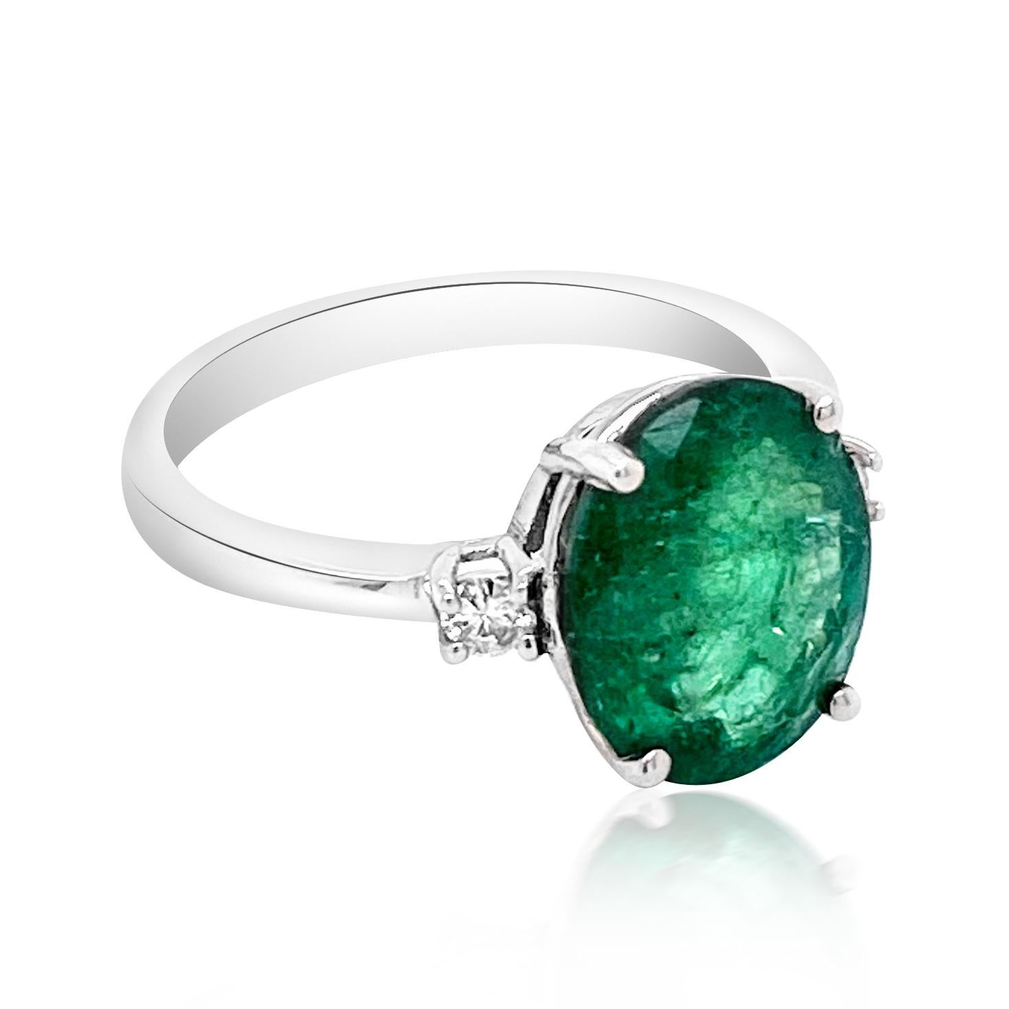  14KWHITE GOLD NATURAL COLOMBIAN EMERALD RING:2.12 GRAMS/COLOMBIAN EMERALD:2.89CT/ DIAMOND RD:0.08CT/#GVR1214 **This 2.89ct Oval Cut Natural Emerald catches the light and gleams like rolling hills of fresh green grass after rain. Of all gemstones,