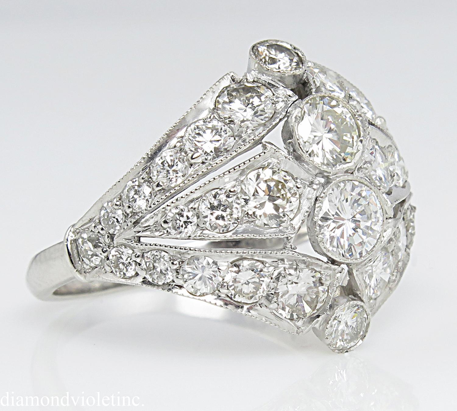 An Amazing Vintage Platinum (stamped) Wedding Anniversary or a Right Hand ring. A one of a kind setting features 32 Round Brilliant Diamonds. Estimated total weight is 2.89ct. EGL USA Certified as H-I-J color, SI2-I1 clarity (eye CLEAR), very Bright