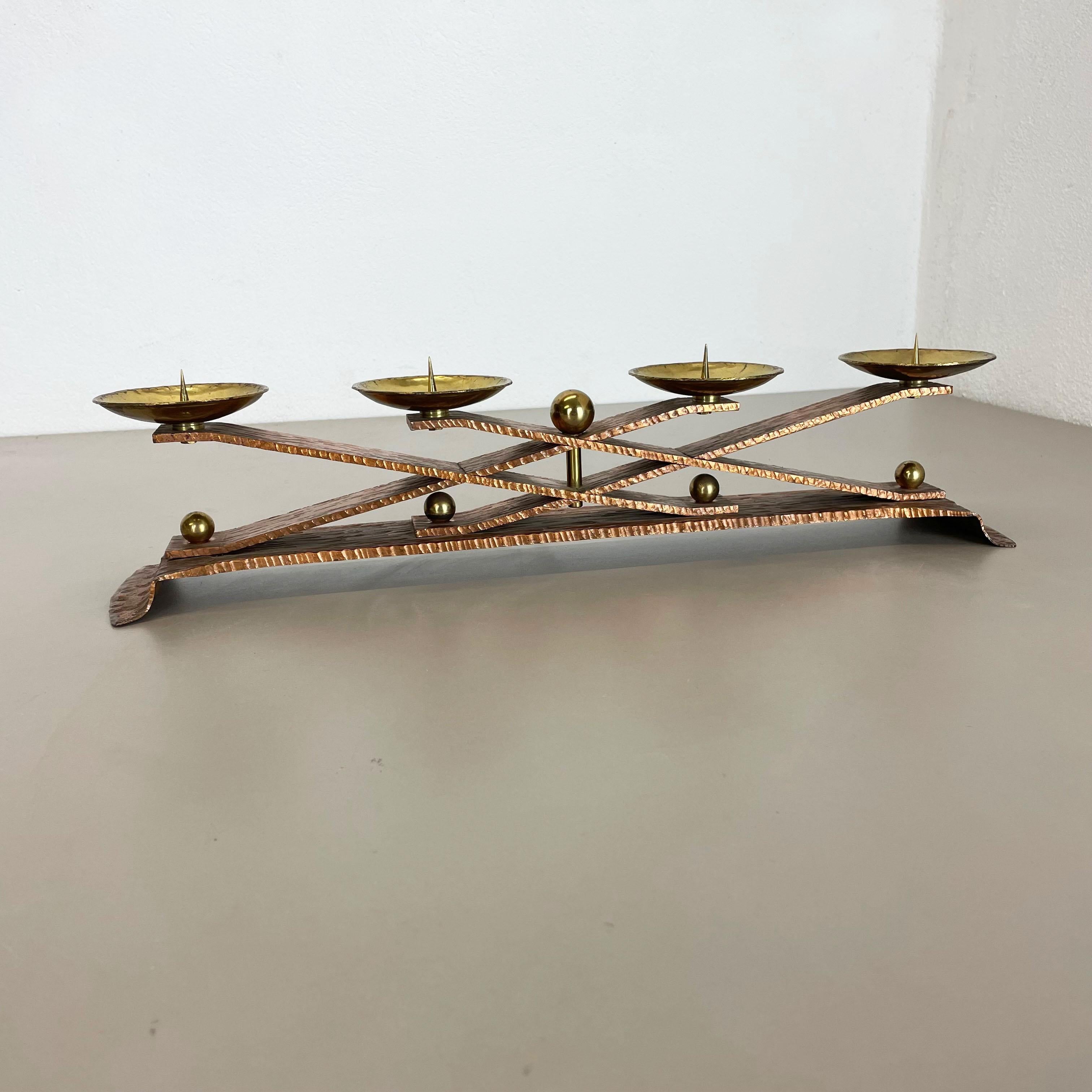 Article:

Brutalist candleholder


Origin:

Austria


Material:

Copper and brass


Decade:

1950s



This original vintage candleholder, was designed and produced in the 1950s in Austria. It is made of solid copper and brass,
