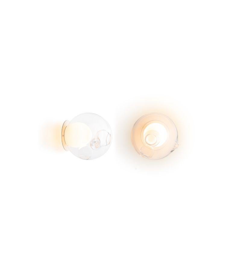 28sp Brass wall lamp by Bocci
Dimensions: Diameter 16.5 x H 11.5 cm 
Materials: blown glass, electrical components, brass mounting plate.
Lamping: : 1.5w LED or 20w xenon. Non-dimmable. 
Also available in different sizes. 
All our lamps can be