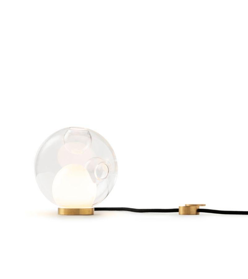 28t cable table lamp by Bocci
Dimensions: Diameter 16.5 x Height 16.5 cm 
Materials: blown glass, black fl exible cord with brass base and dial control
Lamping: : 1.5w LED. Non-dimmable. 
Cable lenght: 229 cm 
Available in different