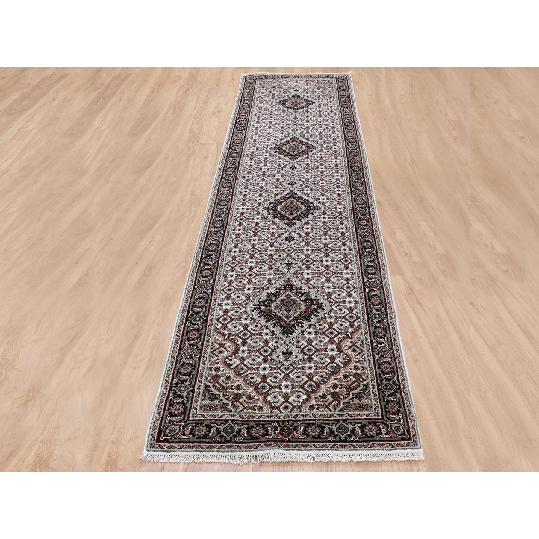 This is a truly genuine one-of-a-kind Ivory Tabriz Mahi Fish Design Wool And Silk Runner Hand Knotted Rug. It has been Knotted for months and months in the centuries-old Persian weaving craftsmanship techniques by expert artisans.
Primary materials: