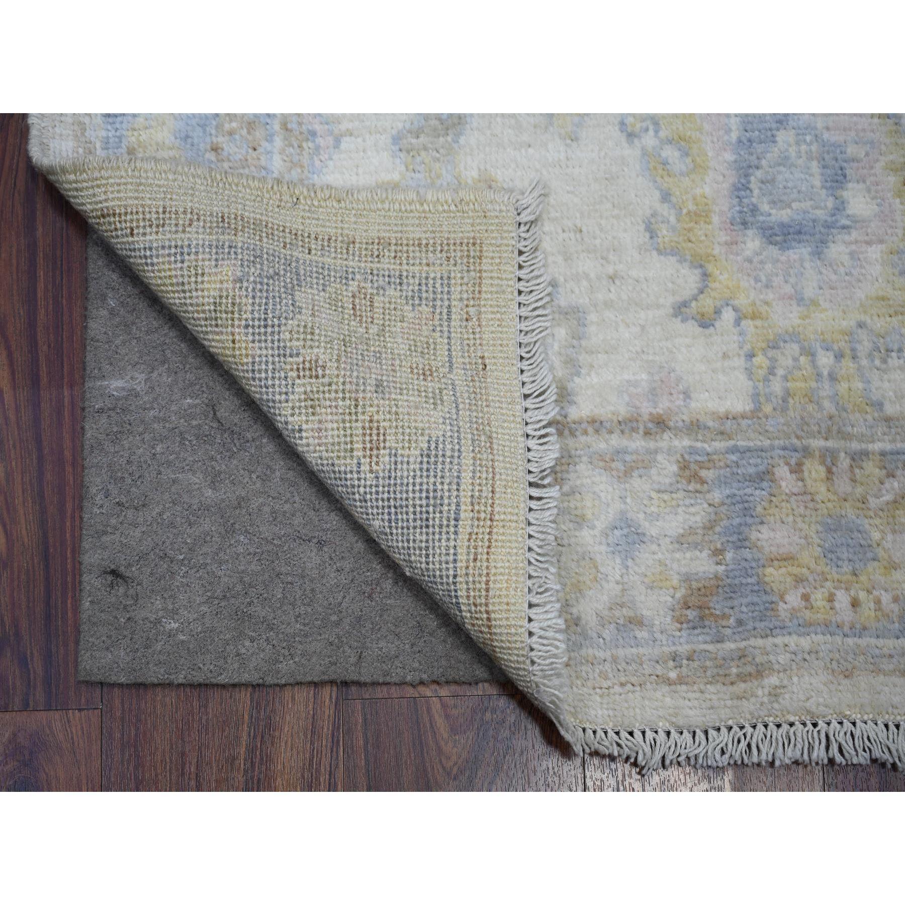 This is a truly genuine one-of-a-kind Ivory, Vegetable Dyes Extra Soft Wool, Hand Knotted Afghan Angora Oushak with Soft Colors, XL Runner Oriental Rug. It has been Knotted for months and months in the centuries-old weaving craftsmanship techniques