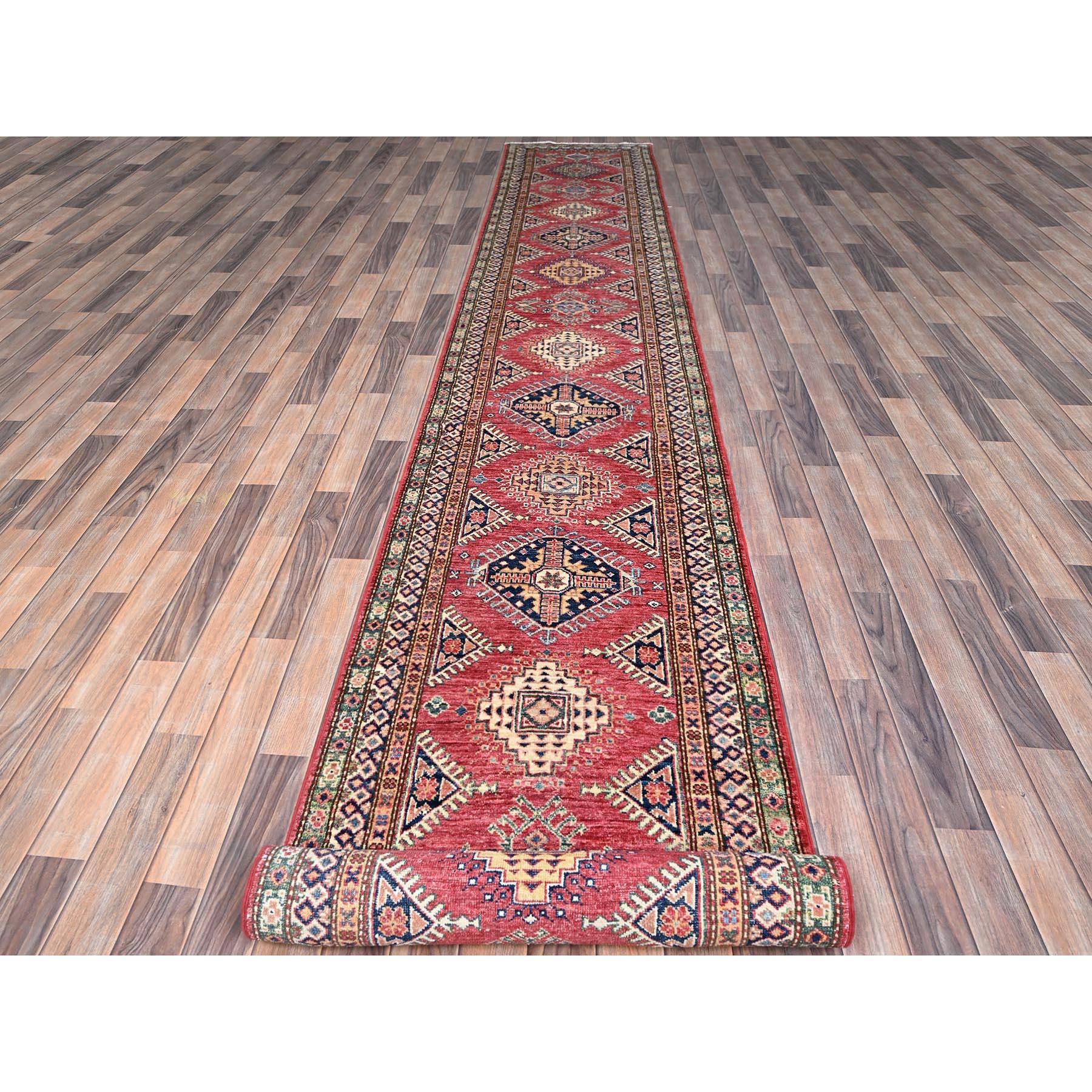 This is a truly genuine one-of-a-kind Afghan Super Kazak, Hand Knotted, Pure Wool, and Oriental Rug. It has been Knotted for months and months in the centuries-old weaving craftsmanship techniques by expert artisans.
Primary materials: Wool
Latex: