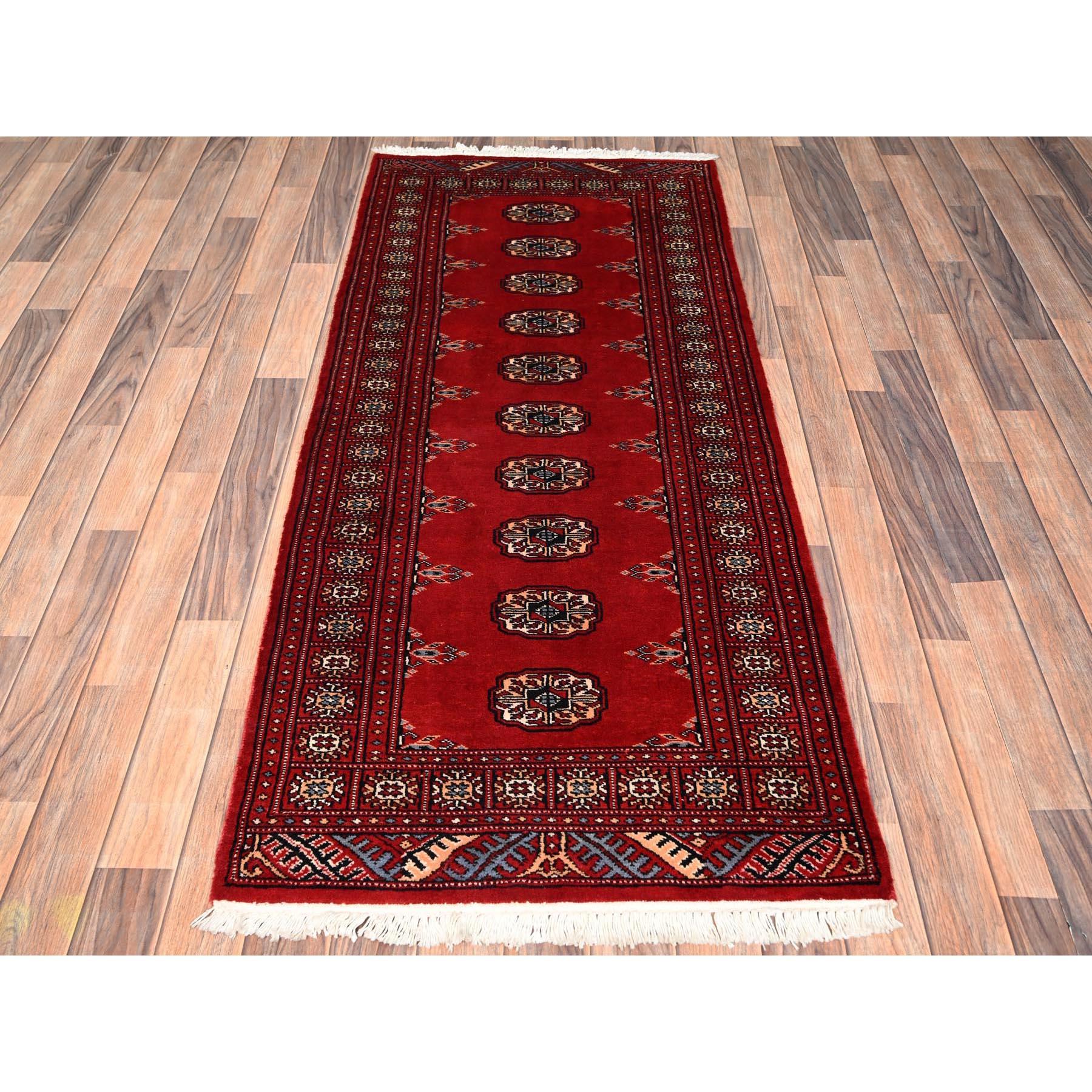 Berry Red, Princess Bokara with Tribal Medallions, Soft and Shiny Wool, Hand Knotted,  Runner, Oriental Rug
Primary materials: Wool
Latex: No Pile 
height: 0.25 Inches
Style: Traditional
Primary color: Red
Secondary colors: Peach, Ivory, Black,