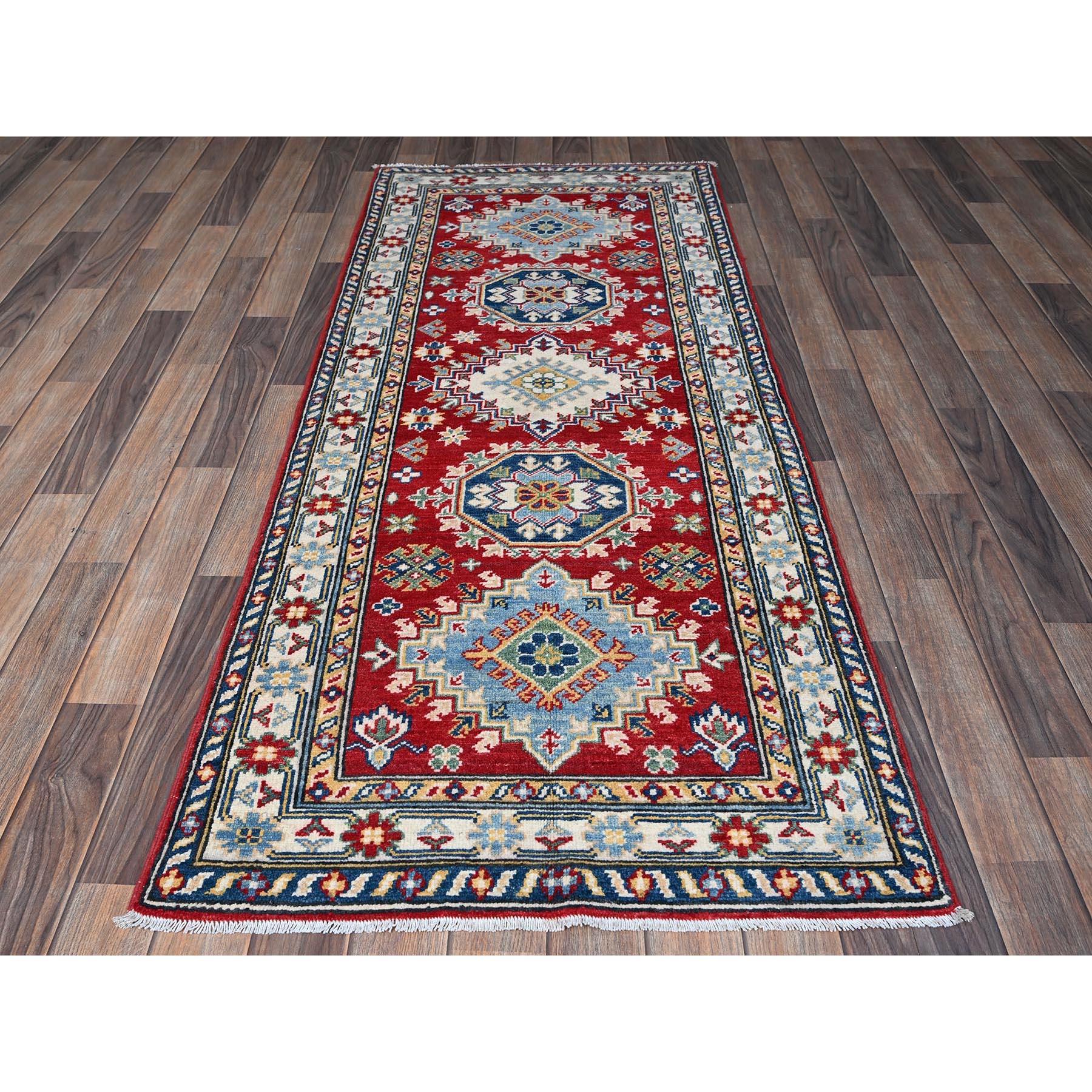 Ajax Red, Kazak with Geometric Medallions Design, Soft and Vibrant Wool, Hand Knotted, Vegetable Dyes, Denser Weave, Runner, Oriental Rug
Primary materials: Wool
Latex: No Pile 
height: 0.25 Inches
Style: Traditional
Primary color: Red
Secondary