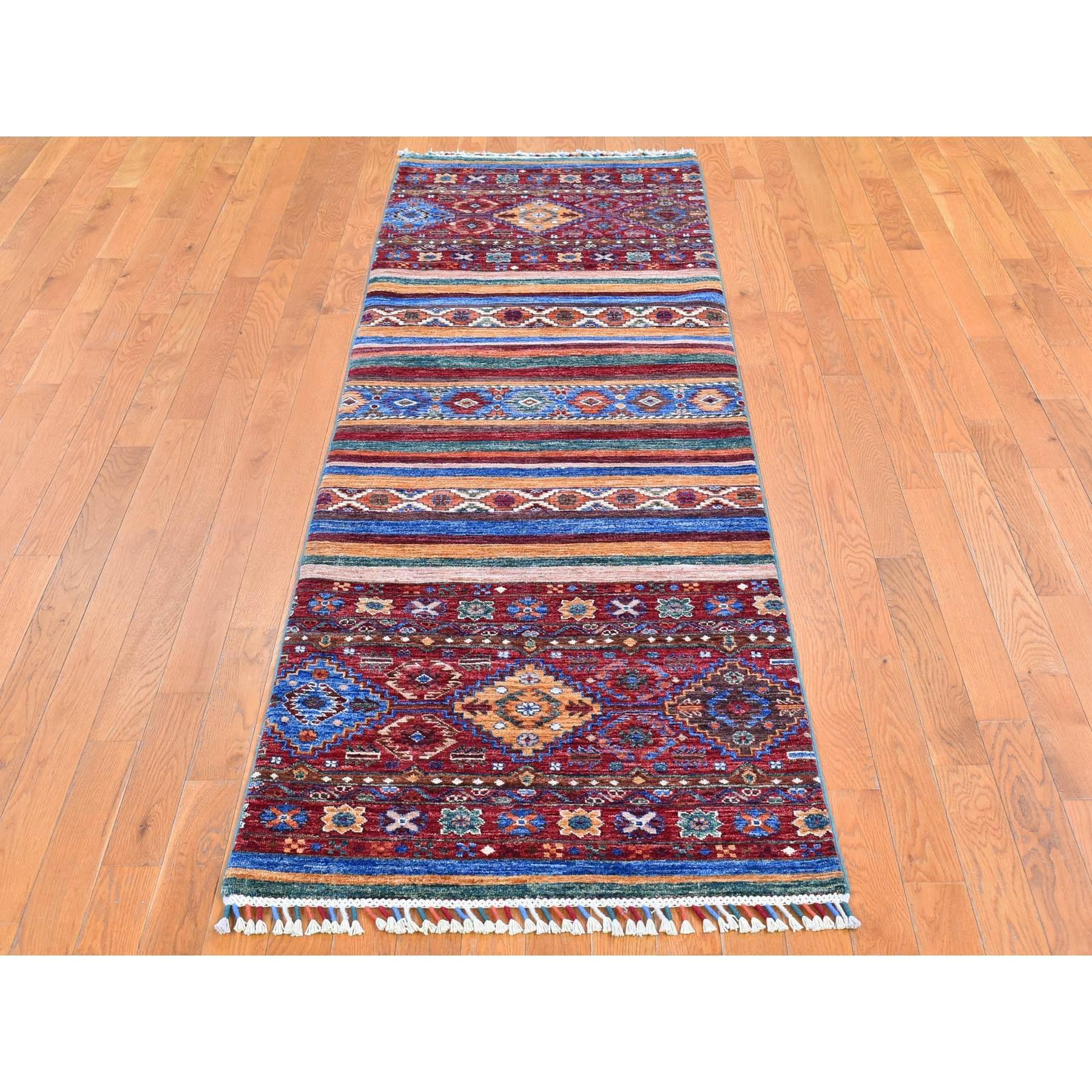 This is a truly genuine one-of-a-kind Red Super Kazak Khorjin Design with Colorful Tassels Pure Wool Hand Knotted Wide Runner Oriental Rug. It has been woven for months and months in the centuries-old Persian weaving craftsmanship techniques by