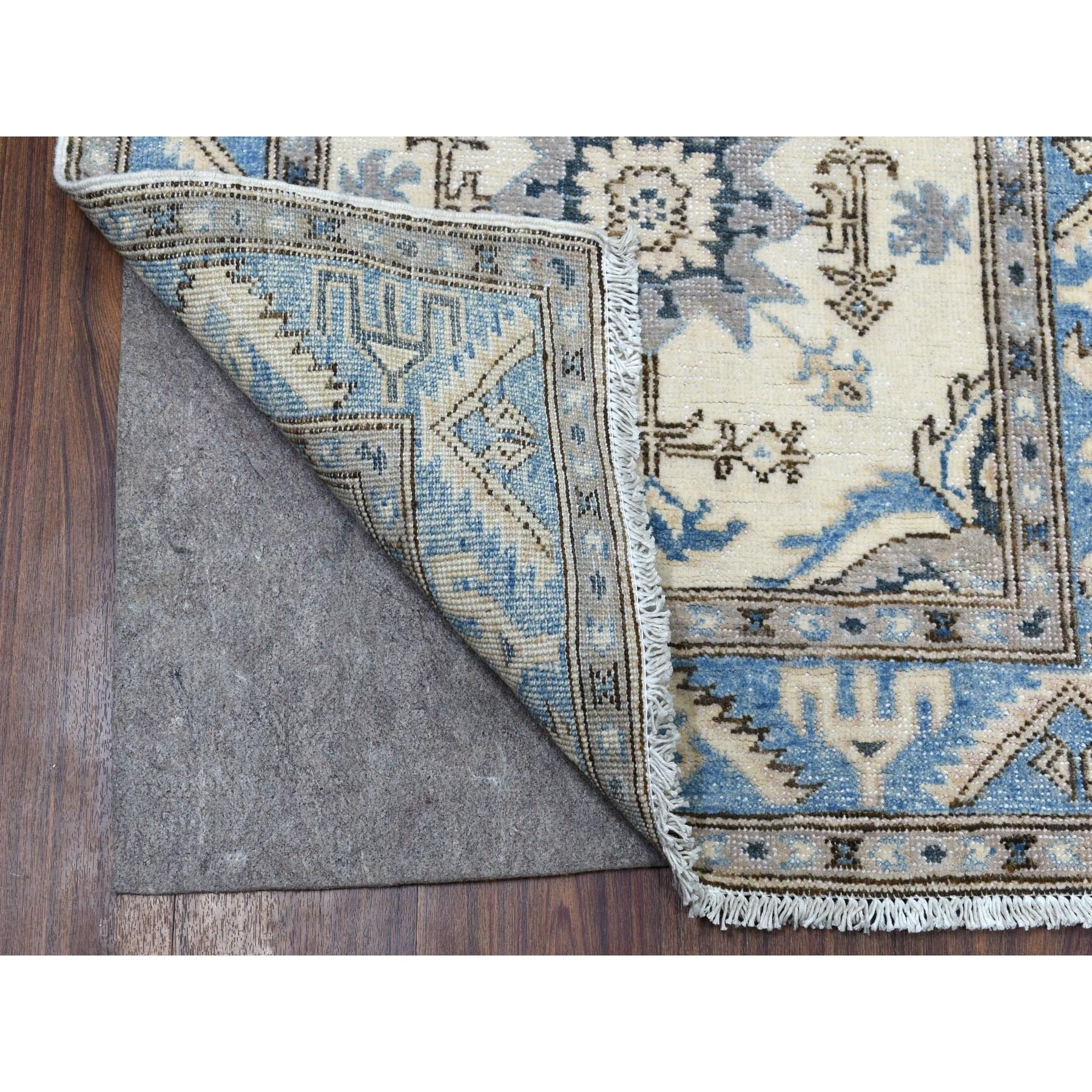 This is a truly genuine one-of-a-kind Ivory Hand Knotted Vintage Look Kazak Pure Wool Tribal Design Runner Oriental Rug. It has been woven for months and months in the centuries-old Persian weaving craftsmanship techniques by expert