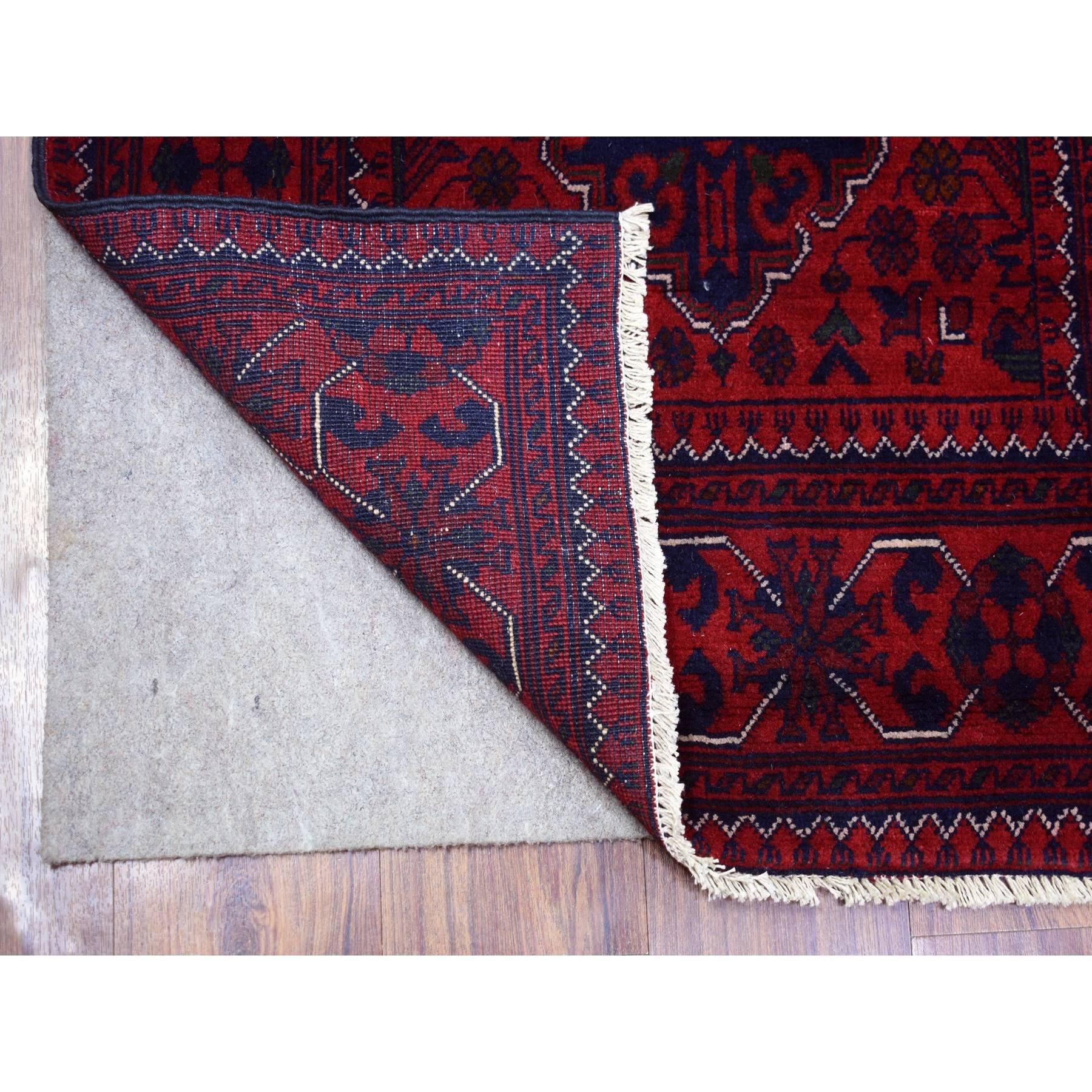 This is a truly genuine one-of-a-kind Red Tribal Design Hand Knotted Afghan Khamyab Wool Runner Oriental Rug. It has been Knotted for months and months in the centuries-old weaving craftsmanship techniques by expert artisans.
Primary materials: