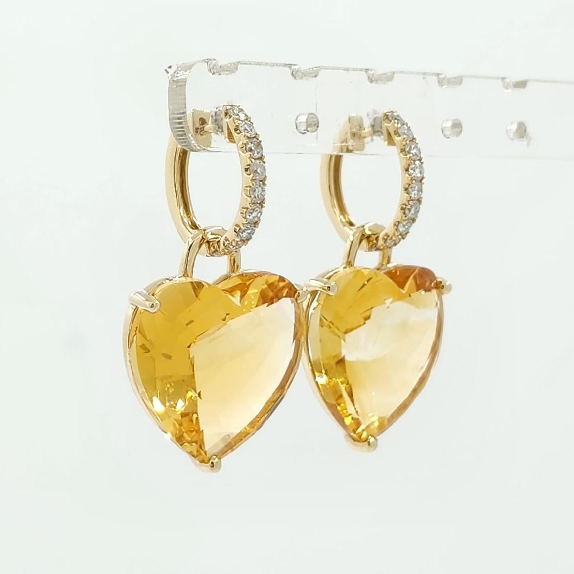 Introducing our exquisite heart-shaped citrine earrings, an emblem of warmth and love meticulously set in radiant 14 karat yellow gold. These earrings are not only remarkable for their luminous citrine stones, weighing a remarkable 28.99 carats but