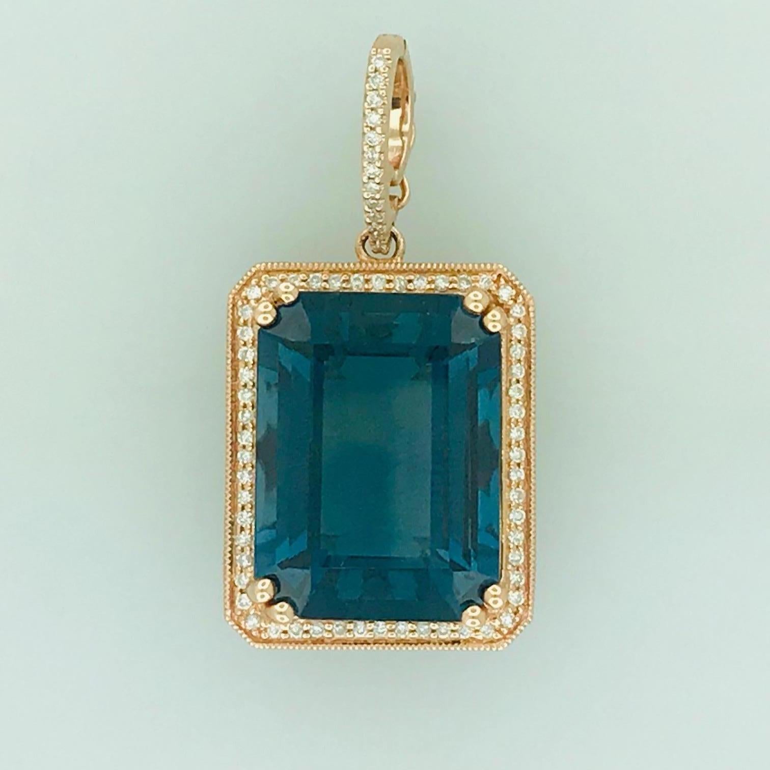 This London Blue Topaz and Diamond Pendant is very unique. The Emerald cut Royal Blue/London Blue Topaz is a rich deep blue color with a hint of green. The color is captivating and especially striking in this rose gold setting. The Royal Blue Topaz