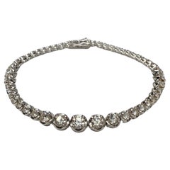 Bracelet Symphonie de diamants gradués de 2,9 carats en or blanc 18K