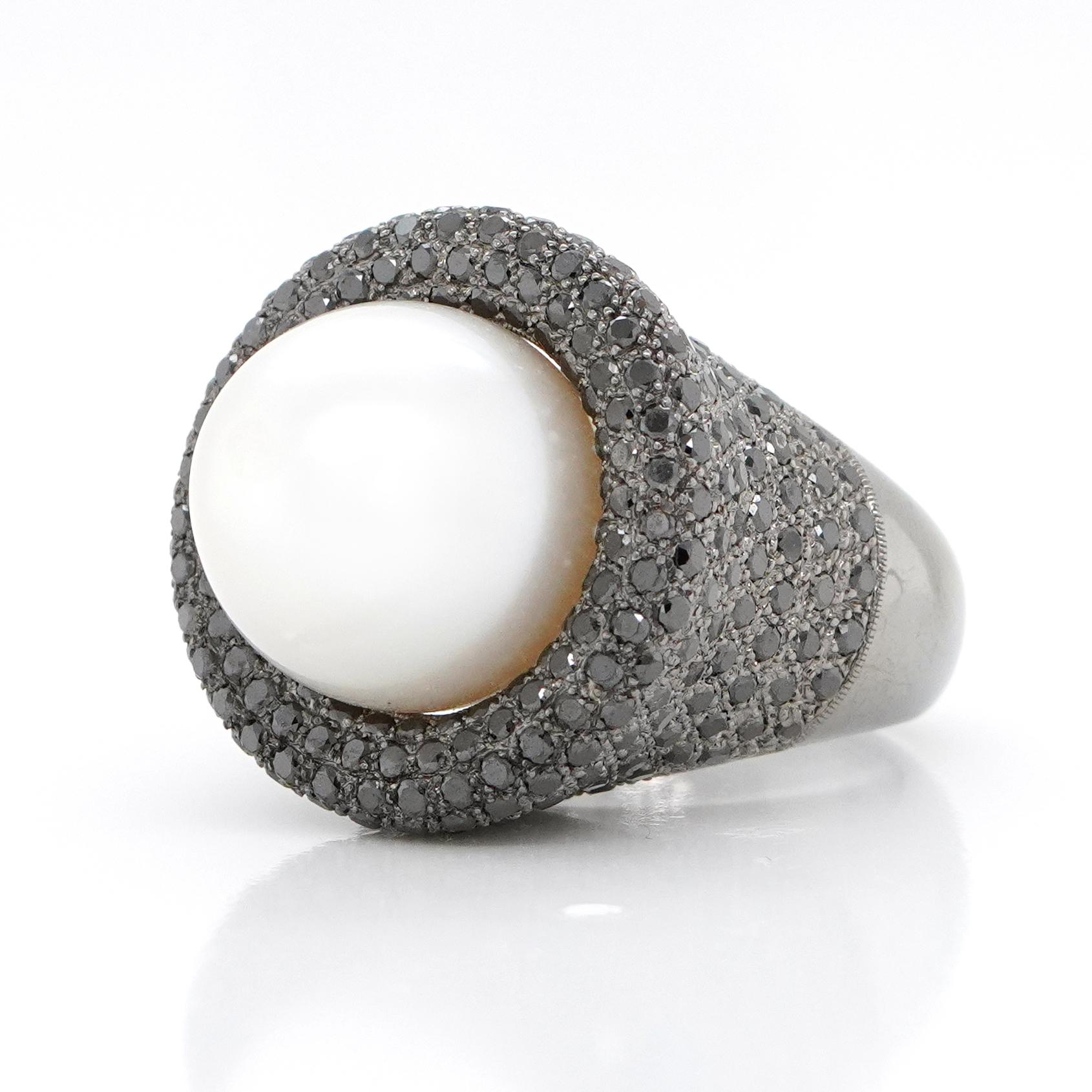 Pearl 25.60 carats
Black Diamond Pave set 301 pieces 3.89 carats
Gold weight 17.45 gms
Total weight 23.35 gms
The ring size is customizable - will take 30-45 days to make and ship if customizing with another gemstone or size 