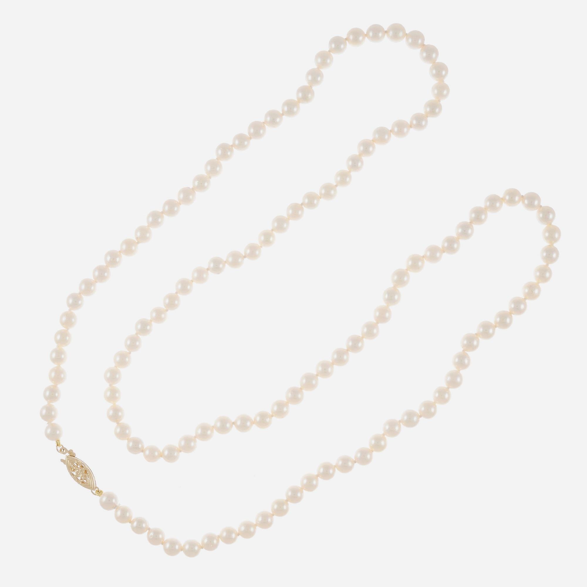 29 inch 5.5 to 6mm Japanese cultured pearl necklace. White with a touch of warm overtone freshly strung to a new 14k yellow gold catch. Very good lustre, few to moderate blemishes

118 cultured white with crème hue, 5.5-6mm
14k yellow gold 
Stamped: