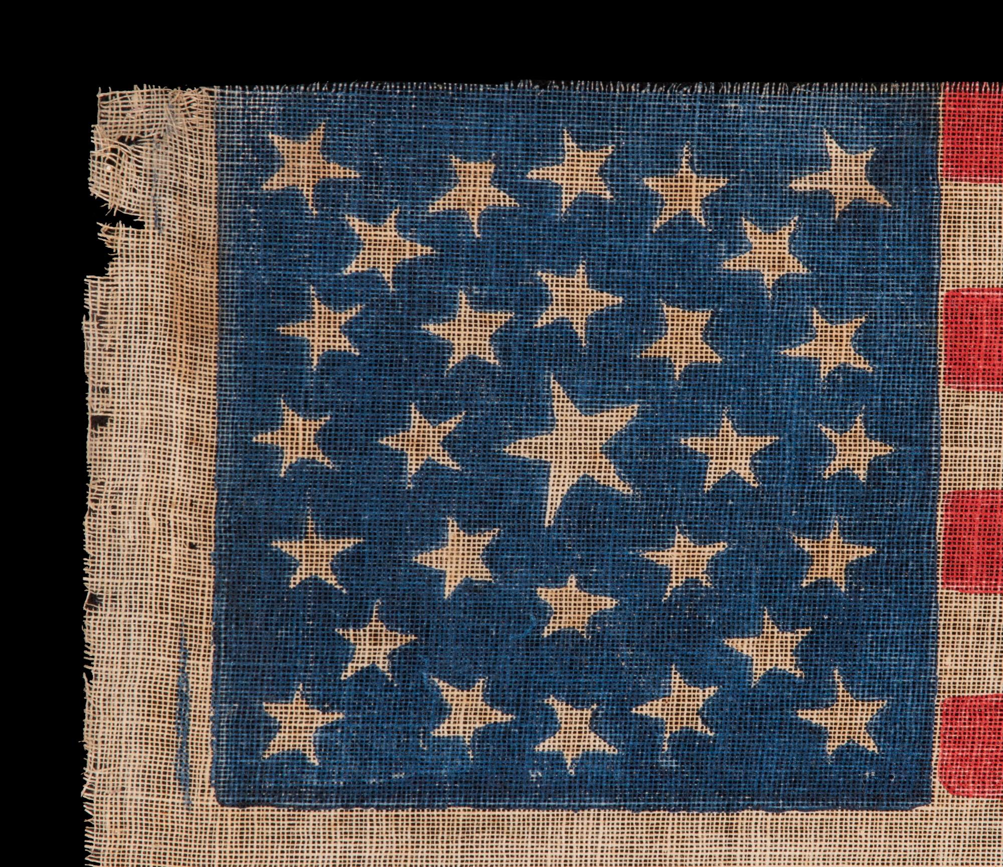 29 STAR ANTIQUE AMERICAN FLAG WITH A DOUBLE-WREATH STYLE MEDALLION CONFIGURATION, MEXICAN WAR ERA, 1846-48; REFLECTS THE ADDITION OF IOWA AS THE 29TH STATE

29 star American national parade flag, printed on coarse, glazed cotton. The stars are