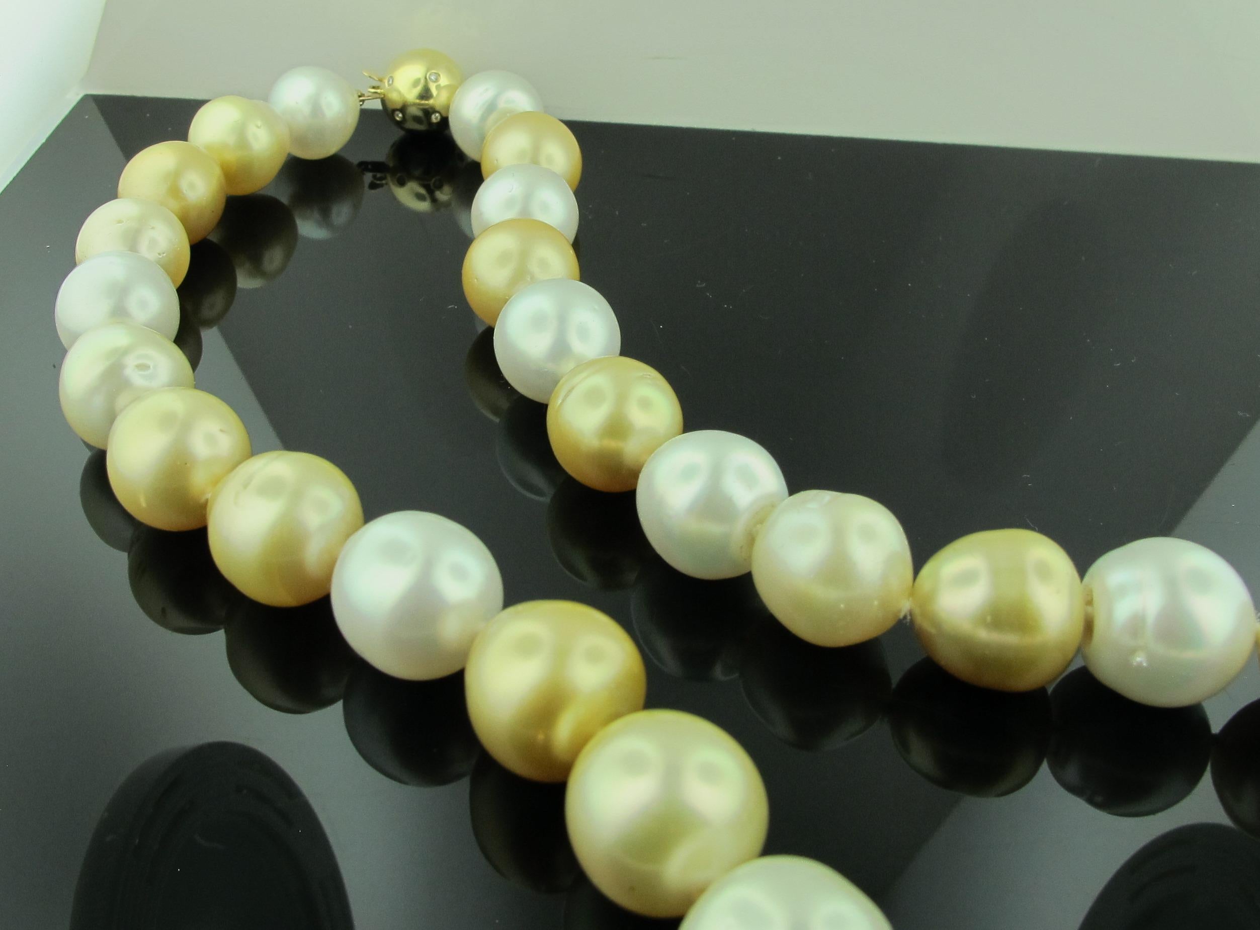 A mixture of 29 white and gold pearls with an ascending range of 13-15.8 millimeters in size.  The necklace is 18