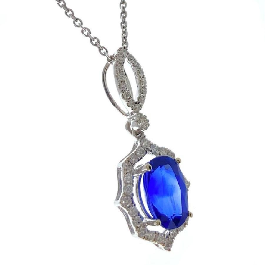This exquisite pendant features a striking 2.90-carat blue oval sapphire, celebrated for its deep, vivid hue and exceptional brilliance. The sapphire is gracefully set in a refined 14k white gold setting, which enhances its rich color and adds a