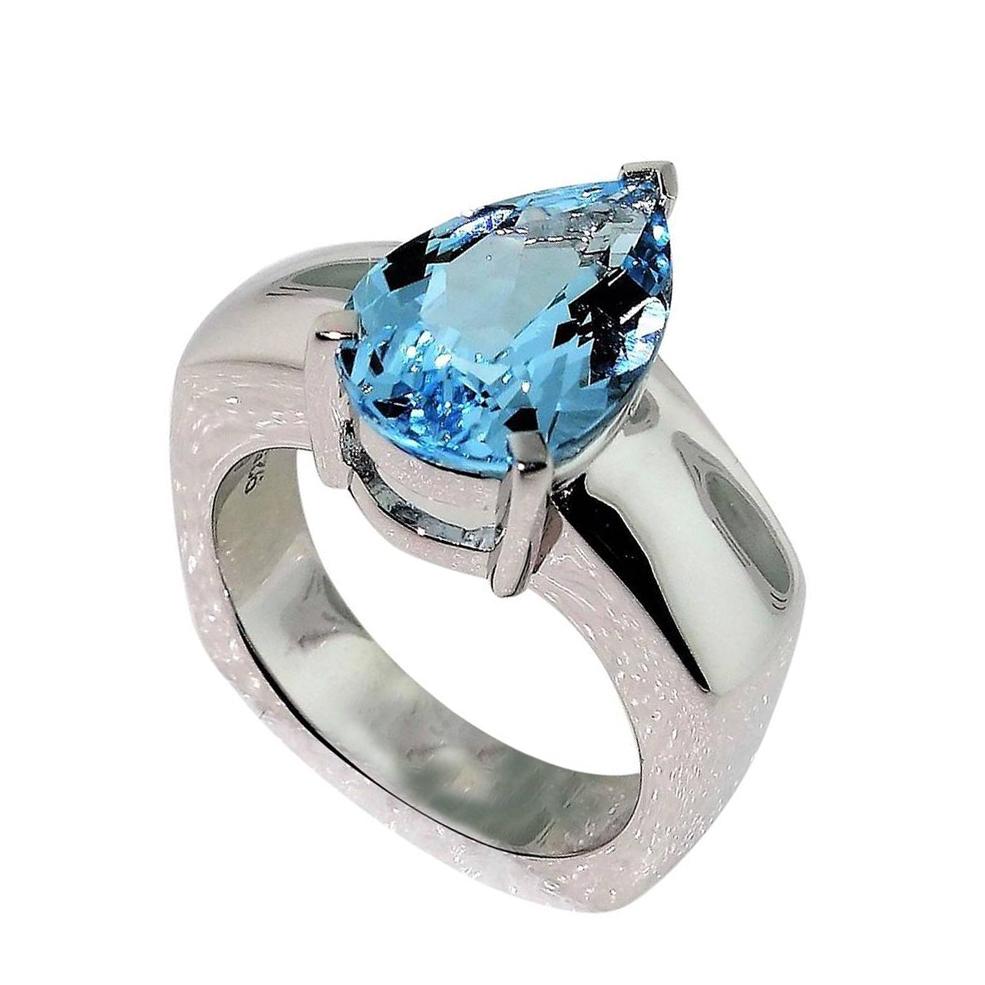 Beautiful ring featuring a 2.90ct Blue Topaz in center enhanced with Diamonds; approx. .06tctw; Sterling Silver Tarnish-resistant Rhodium mounting. Size 7. Stylish and Classy…illuminating your look with Timeless Beauty! 
