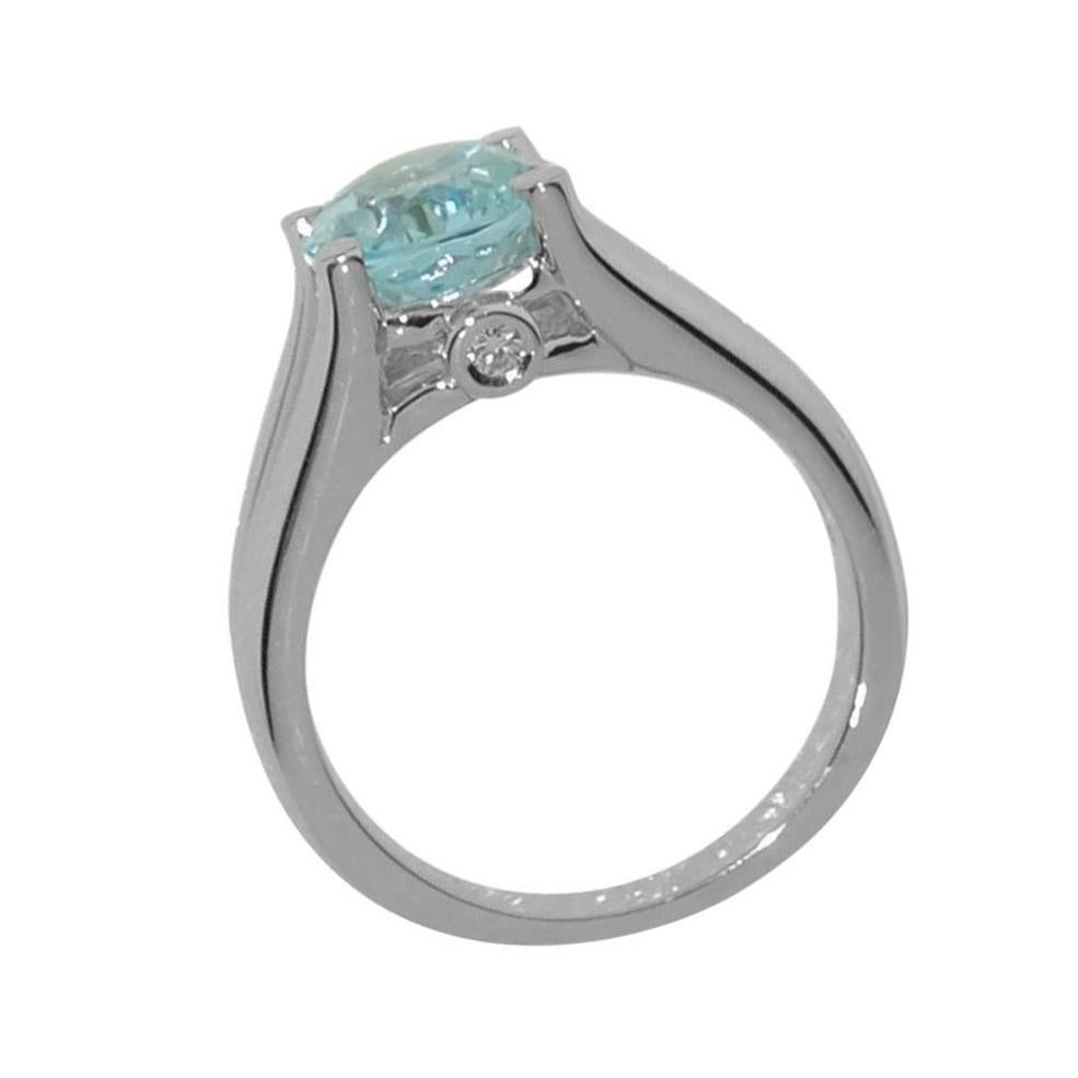 Beautiful ring featuring a 2.90ct Blue Topaz in center enhanced with Diamonds; approx. .06tctw; Sterling Silver Tarnish-resistant Rhodium mounting. Size 7; we offer complimentary ring re-sizing; Classic and Classy …illuminating your look with