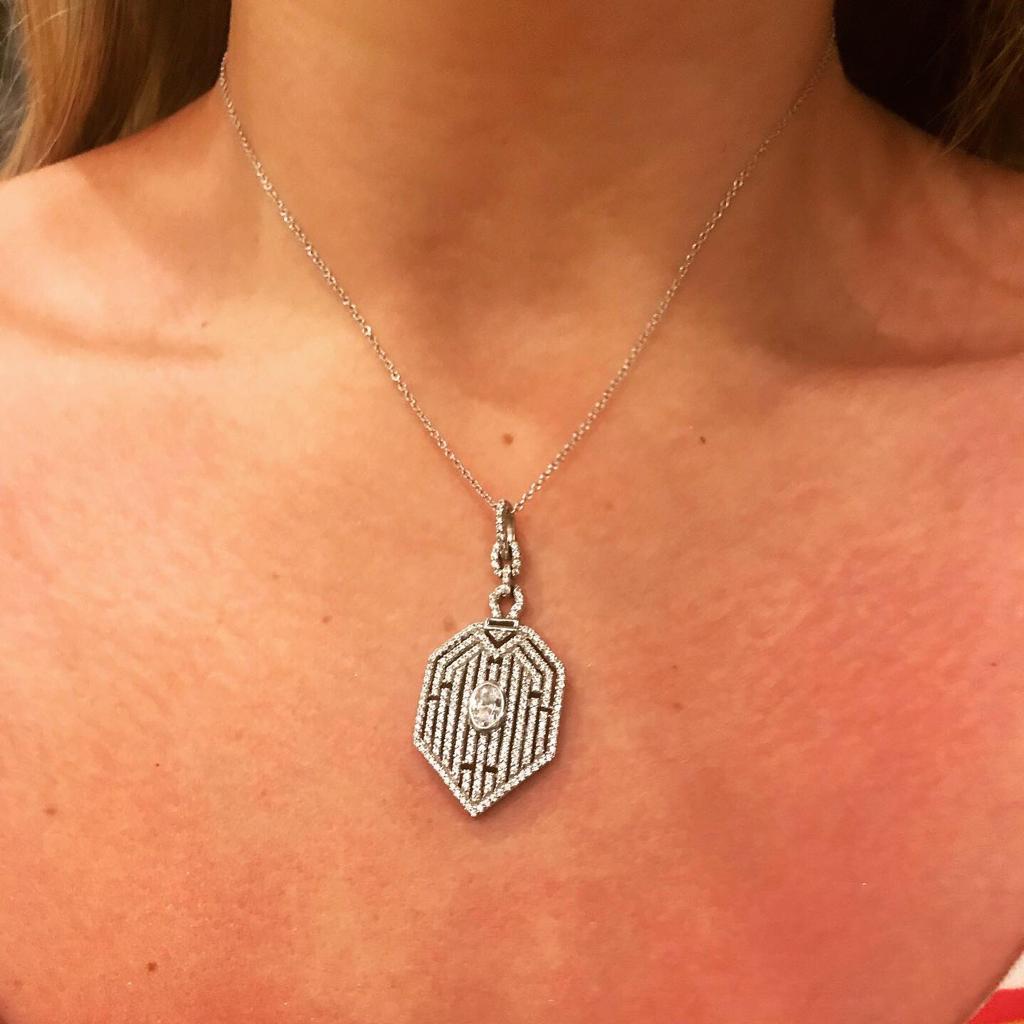 Part of our Deco collection, this sparkling hexagonal frame displays 13 vertical lines of the finest round brilliant cut cubic zirconia set into a symmetrical geometric design.

The centre of this 1930's inspired pendant is embellished with a