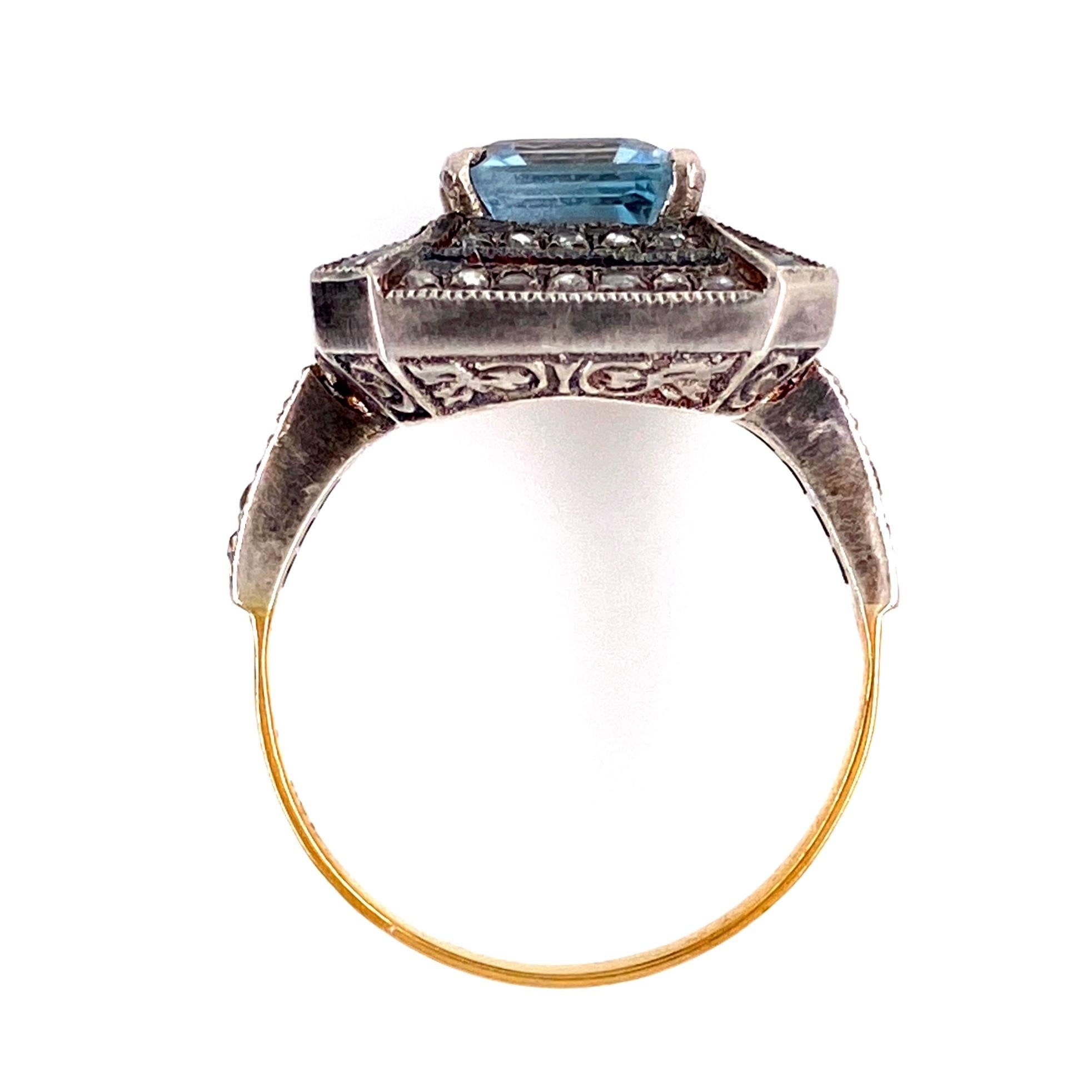Stunning Solitaire Cocktail ring featuring a securely nestled 2.90 Carat oval Emerald-cut Aquamarine Gemstone, each corner enhanced with a Kite-shaped Aquamarines, weighing approx. 0.20 tctw and 62 Rose-cut Diamonds, weighing approx. 0.60 tcw;