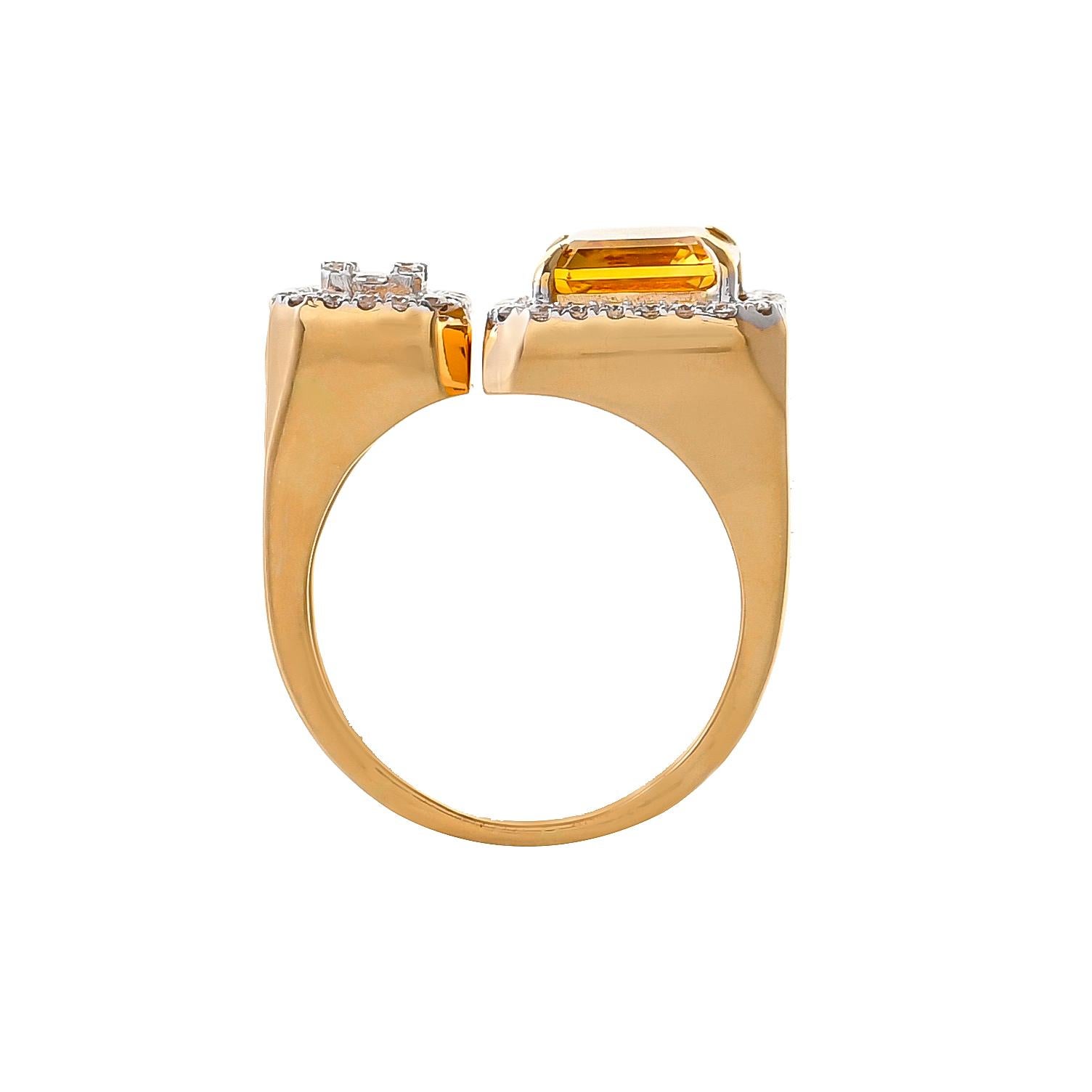 Make a bold statement with this 18kt yellow gold open band ring featuring octagon-shaped honey quartz weighing approximately 2.90 carats set within a frame of round diamonds, the other terminal is set with diamond baguettes surrounded with diamonds