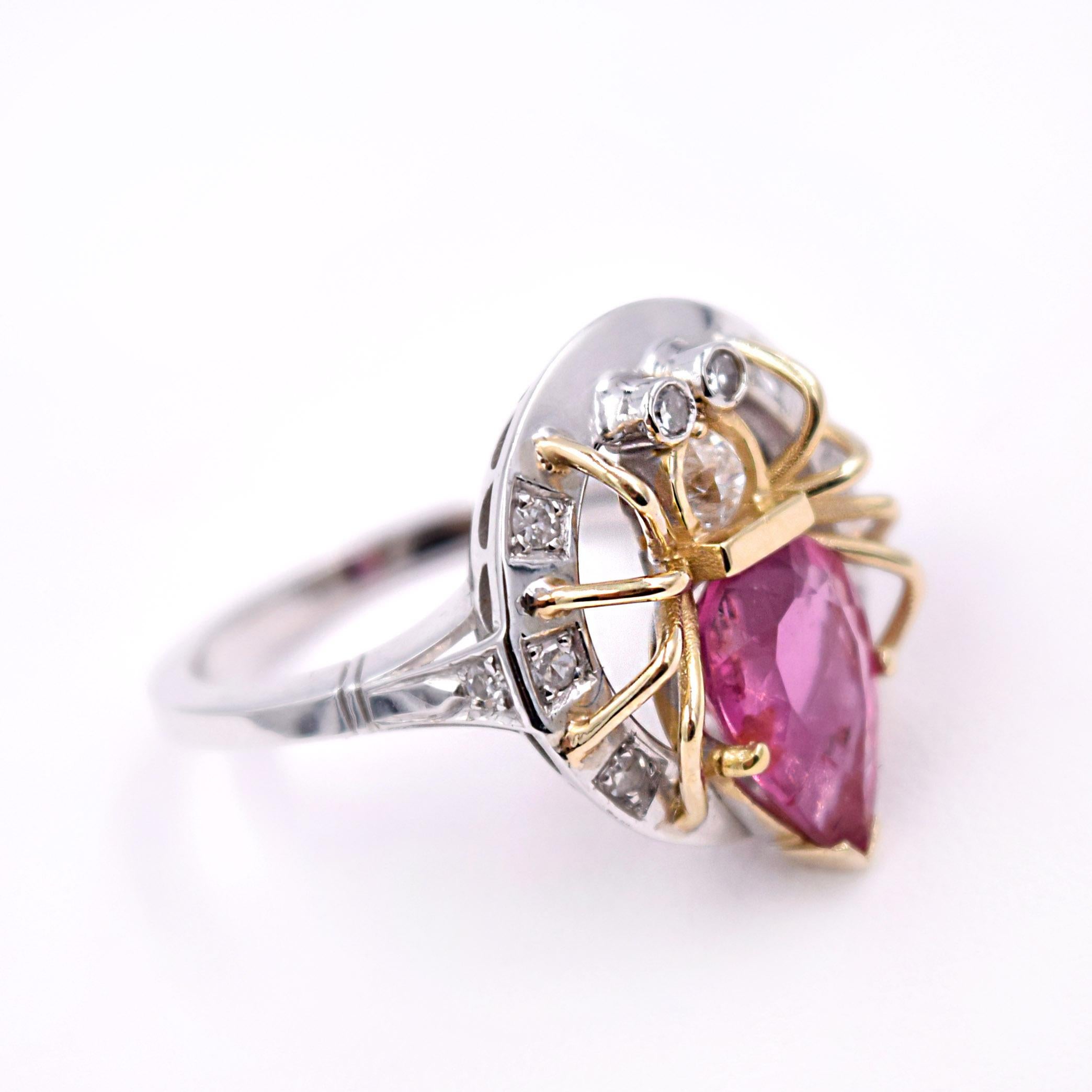 Tourmaline Spider Ring designed by Jennifer Weir.
2.90 Carat Pear shaped Pink Tourmaline and 0.20 Carat White Diamonds 
The metal is 14 Karat Yellow Gold and White Rhodium
Size of the ring is 7.75 and can be sized