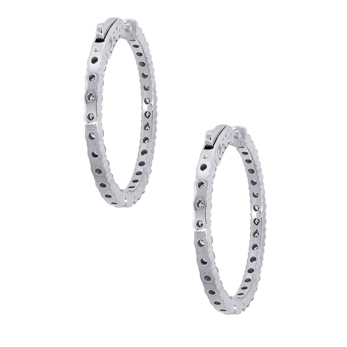 Material: 14k White Gold
Style: Diamond Inside Out Hoops
Diamond Details: Approximately 2.90ctw of round brilliant diamonds. Diamonds are G/H in color and SI in clarity.
Earring Measurements: 1.25″ x 0.12″ x 1.25″
Total Weight: 8.8g (5.7dwt)
Earring