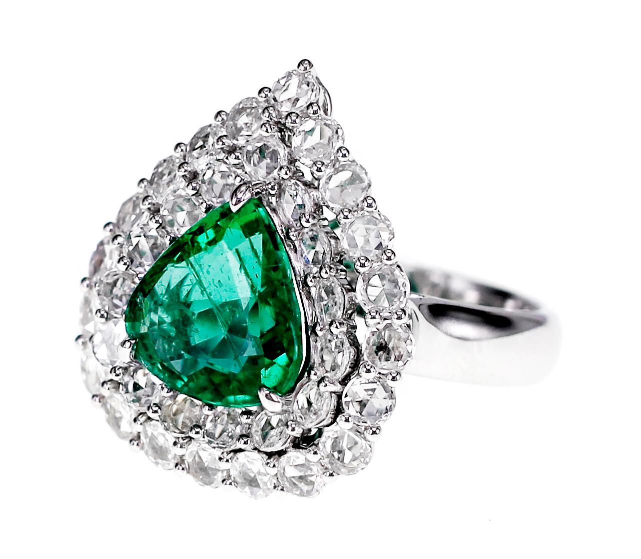 Top quality, vivid green emerald of 2.90 carat size is set along with 1.43 carat of F color Vs clarity old European cut diamond, 
Ring Size: US 6.25