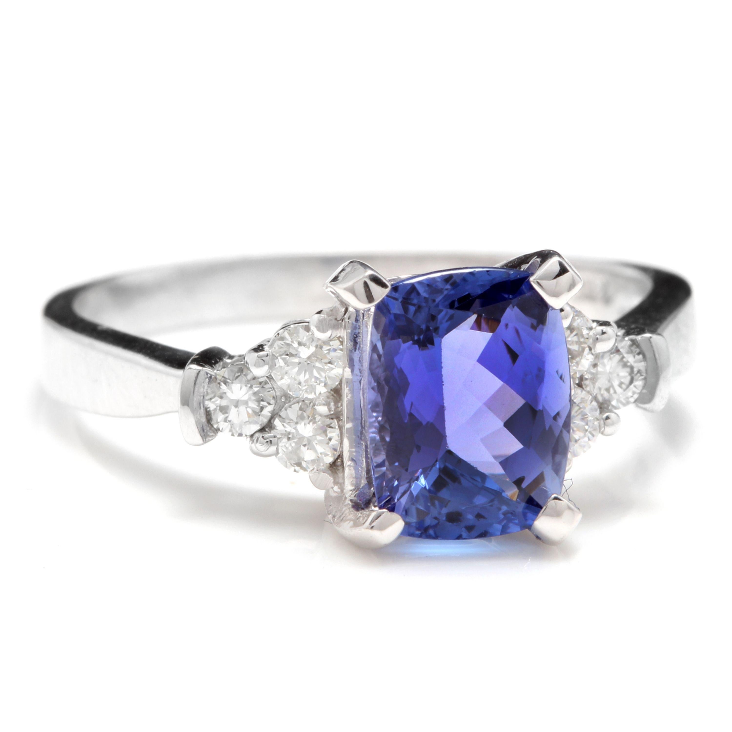 2.90 Carats Natural Very Nice Looking Tanzanite and Diamond 14K Solid White Gold Ring

Total Natural Cushion Tanzanite Weight is: Approx. 2.60 Carats

Natural Round Diamonds Weight: Approx. 0.30 Carats (color G-H / Clarity SI)

Tanzanite Treatment: