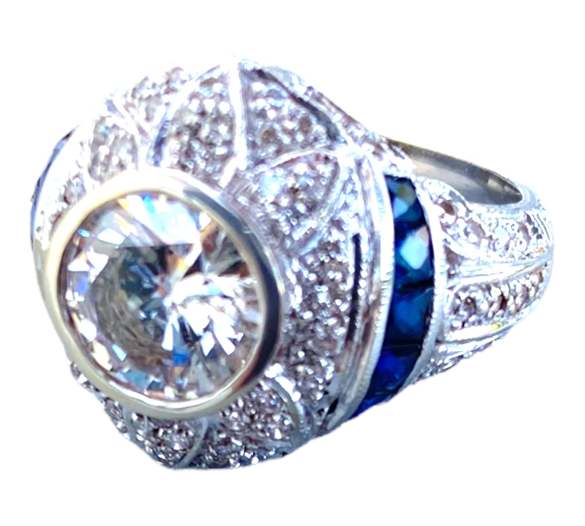 Edwardian Diamond and Sapphire Ring 18 Karat White Gold

Circa's late 1800s-style ring consists of a round center diamond set in a 15.77 mm dome-shaped ring with blue sapphires. The eight sapphires are french cut, princess shaped, and placed on