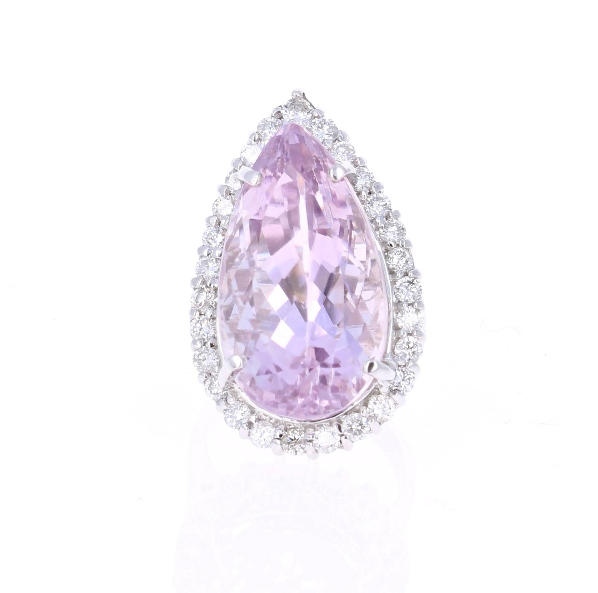 This stunning show stopper has a huge Pear Cut 27.81 carat Kunzite that is set in the center of the ring, it is surrounded by a row of 27 Round Cut Diamonds that weigh 1.26 carats (Clarity: SI2, Color: F).  The total carat weight of the ring is