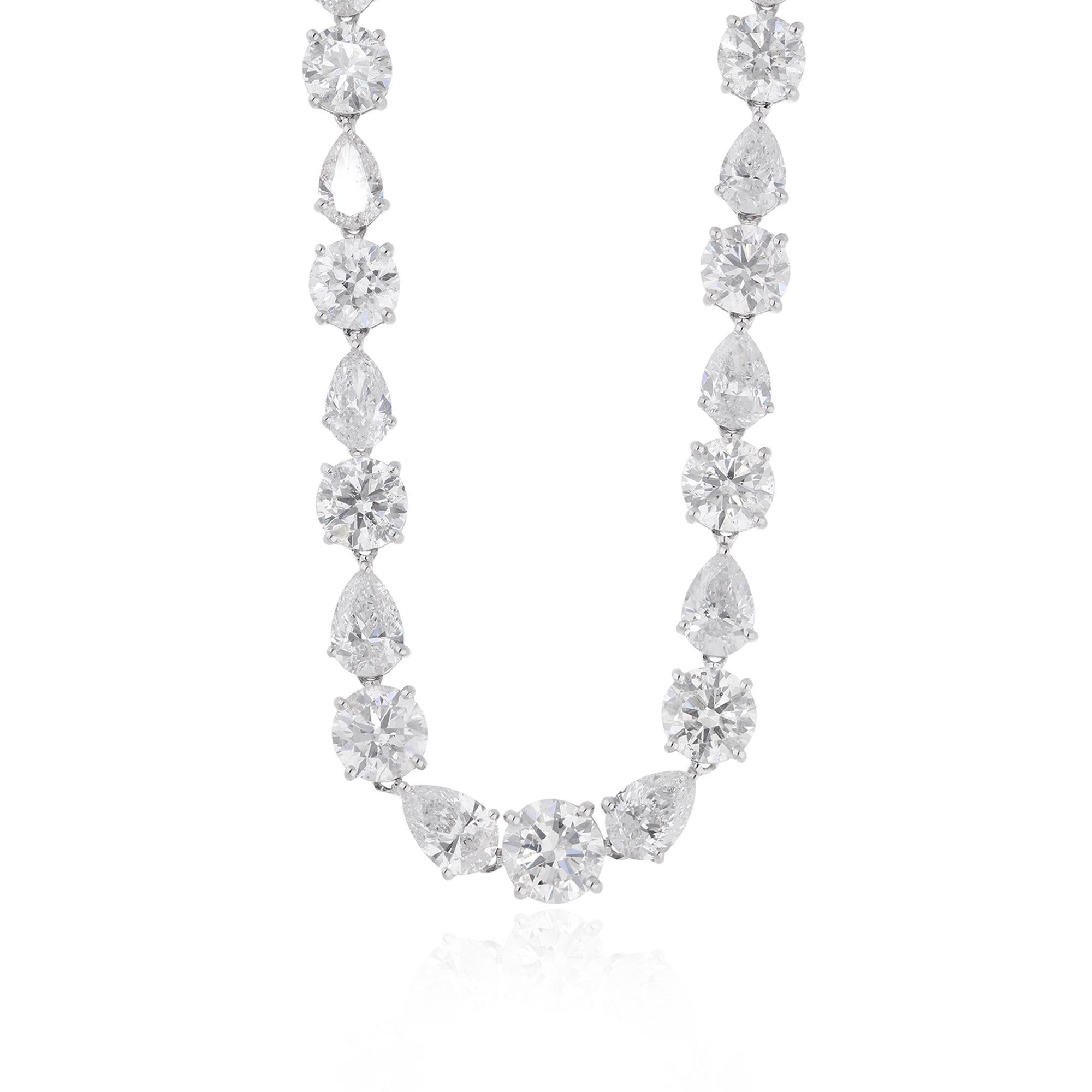 At the heart of this stunning necklace lies a magnificent arrangement of round and pear-shaped diamonds, meticulously selected for their exceptional brilliance, clarity, and fire. With a total carat weight of 29.08, these diamonds exude opulence and