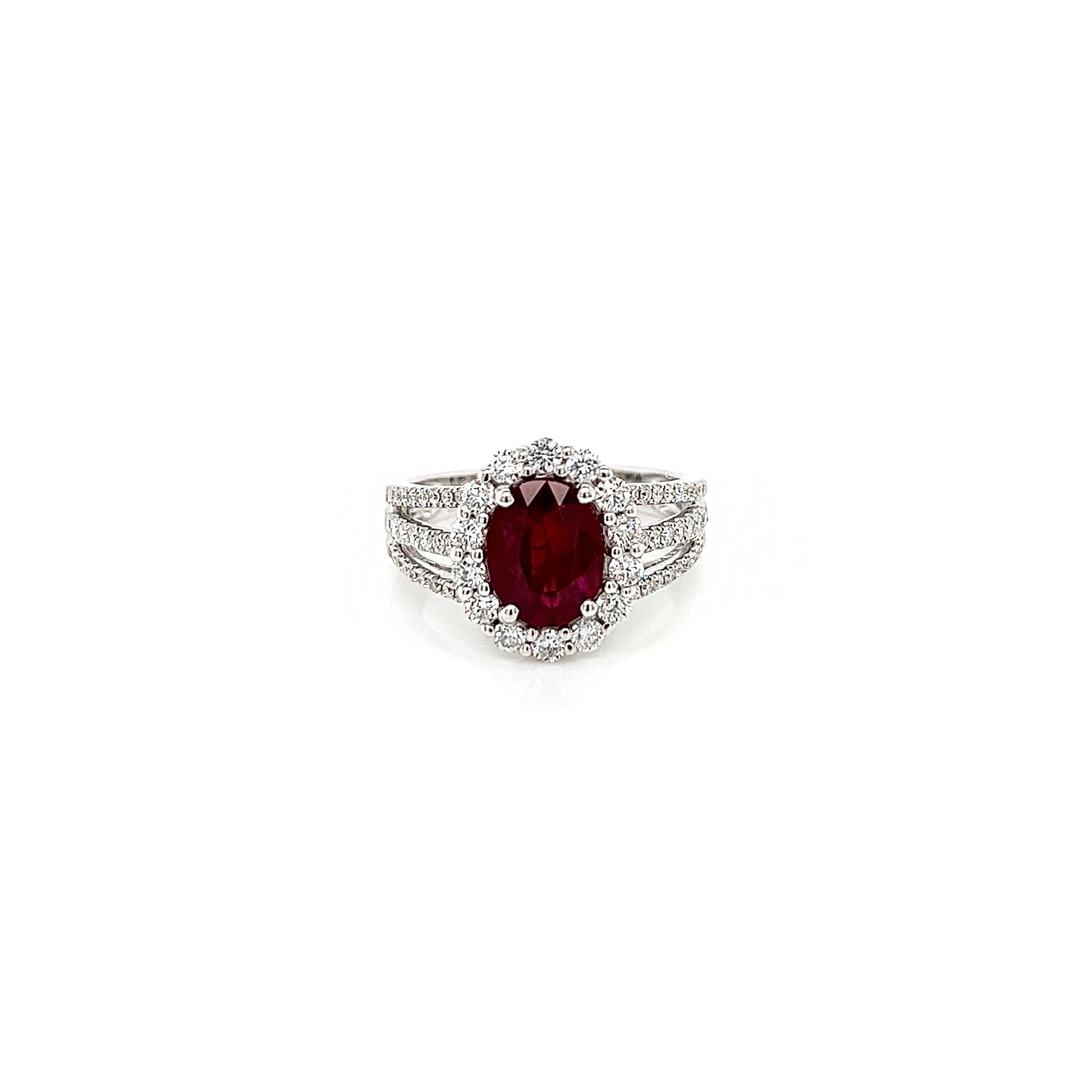 2.90 Total Carat Oval Ruby and Diamond Halo Ladies Ring. GIA Certified.

-Metal Type: 18K White Gold
-2.12 Carat Oval Cut Natural Ruby, GIA Certified 
-Ruby Color: Red
-0.78 Carat Round Natural side Diamonds. F-G Color, VS1-VS2 Clarity

-Size